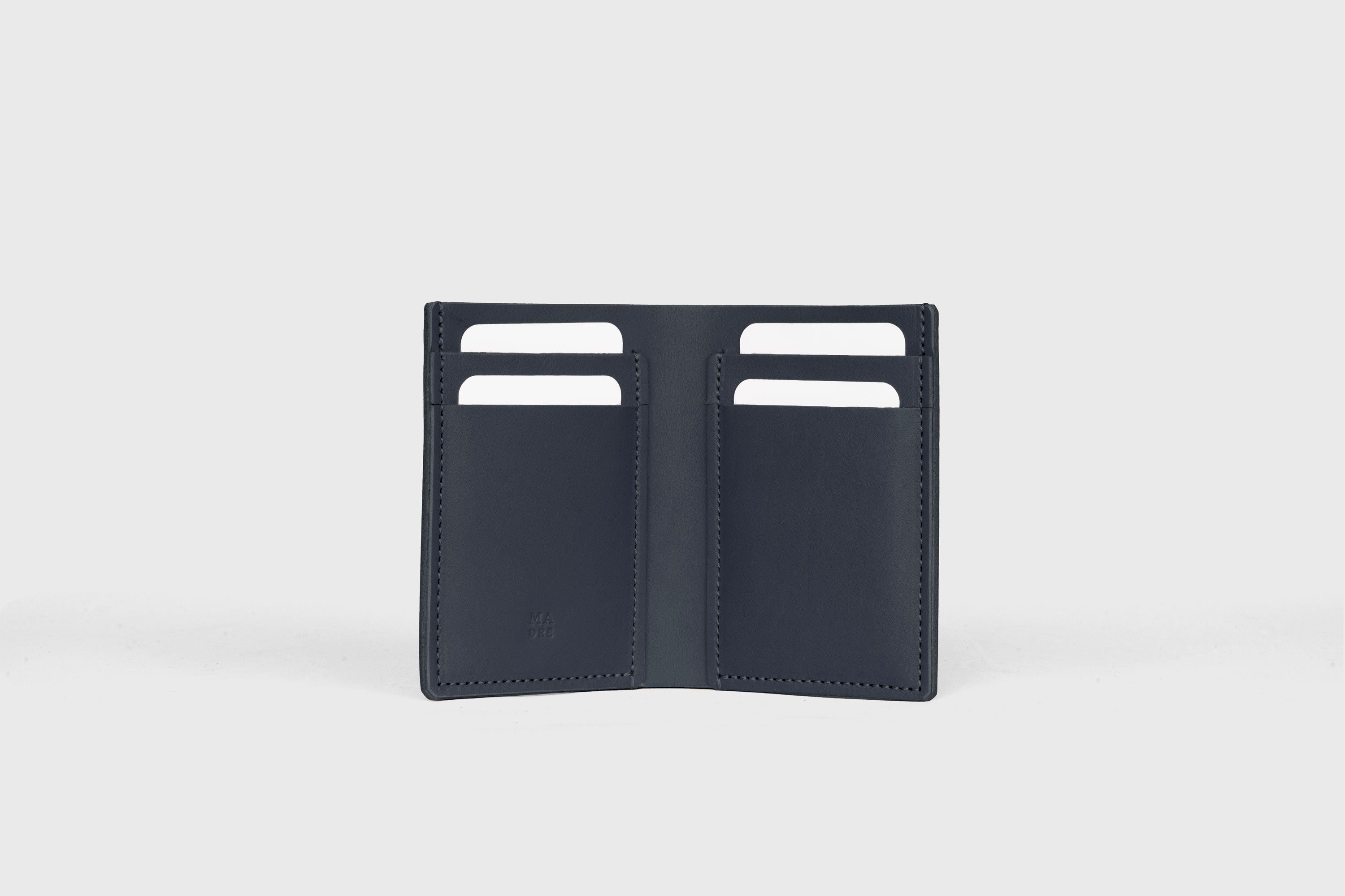 Bifold Wallet Vertical In Marine Blue Color In Vegetable Tanned Leather Minimalistic Slim Design Atelier Madre Manuel Dreesmann Barcelona Spain