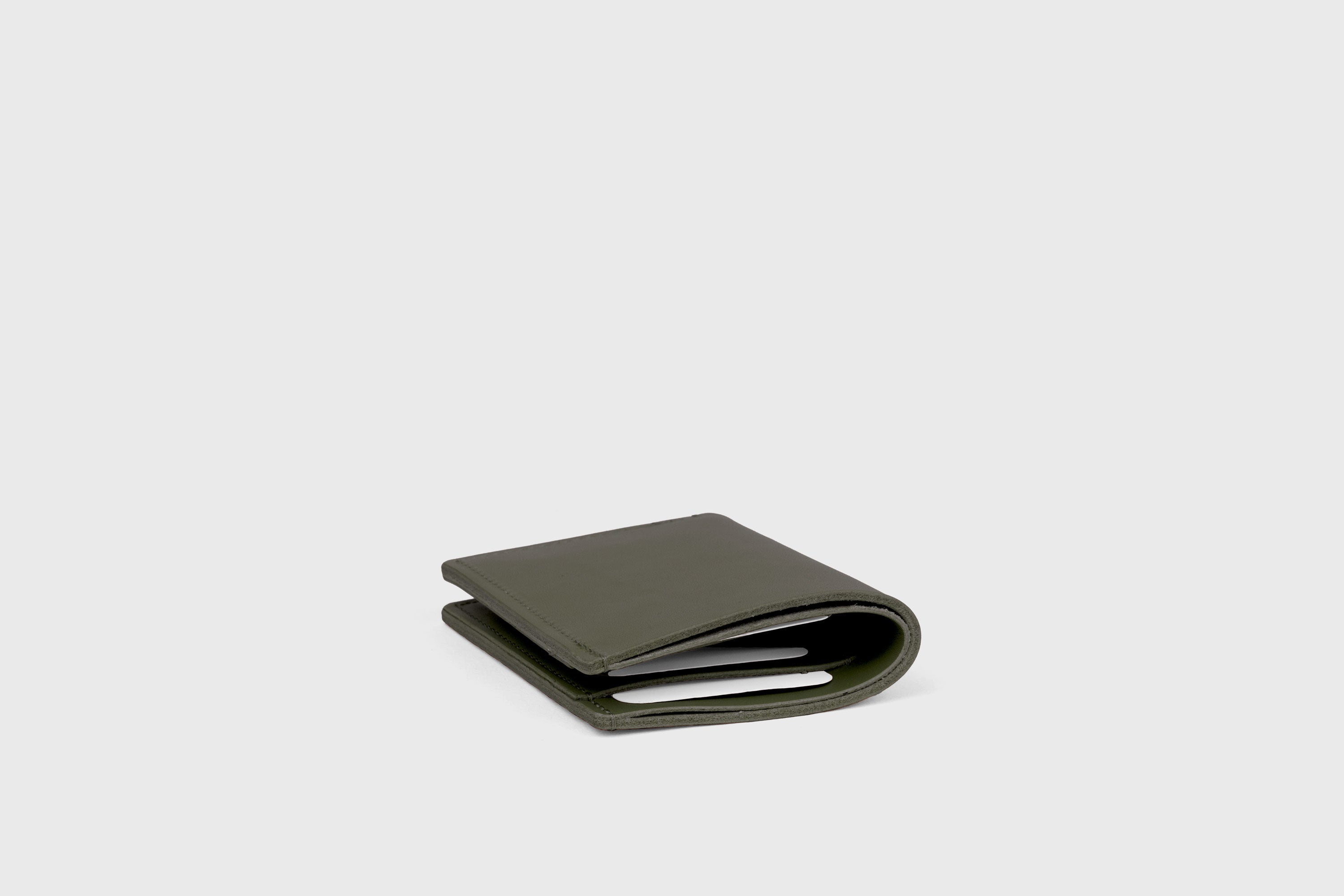 Bifold Wallet Vertical In Olive Green Color In Vegetable Tanned Leather Minimalistic Slim Design Atelier Madre Manuel Dreesmann Barcelona Spain