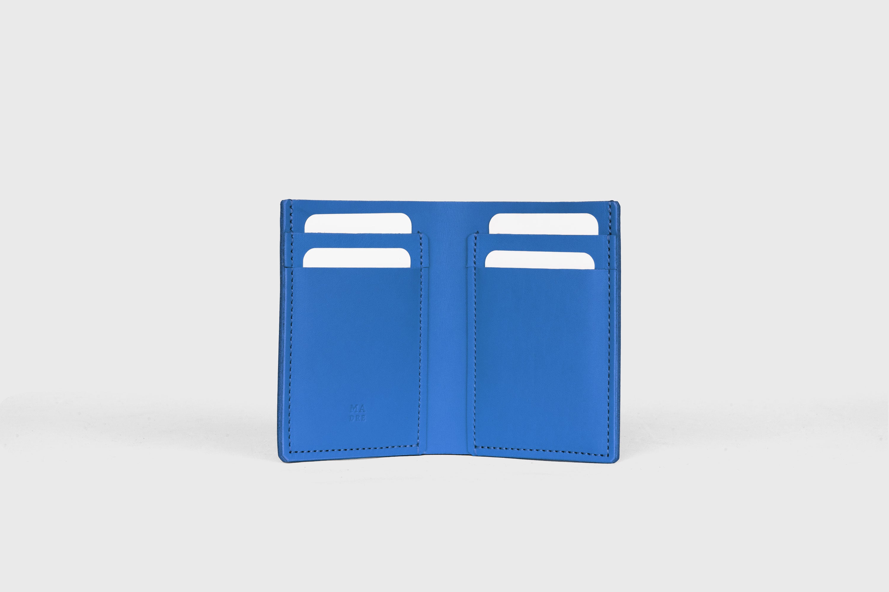 Bifold Wallet Vertical In Royal Blue Color In Vegetable Tanned Leather Minimalistic Slim Design Atelier Madre Manuel Dreesmann Barcelona Spain