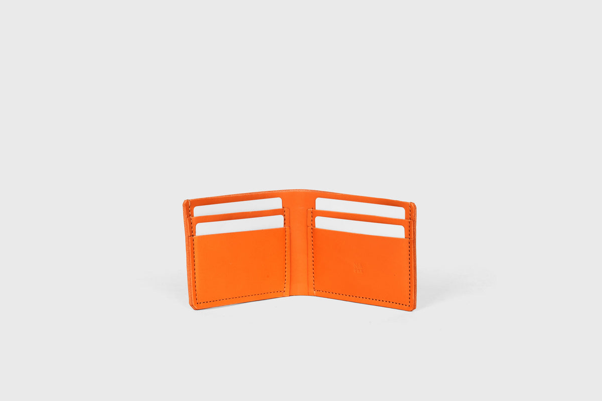 Bifold wallet leather orange color minimalistic design vegetable tanned leather atelier madre manuel dreesmann barcelona spain 1