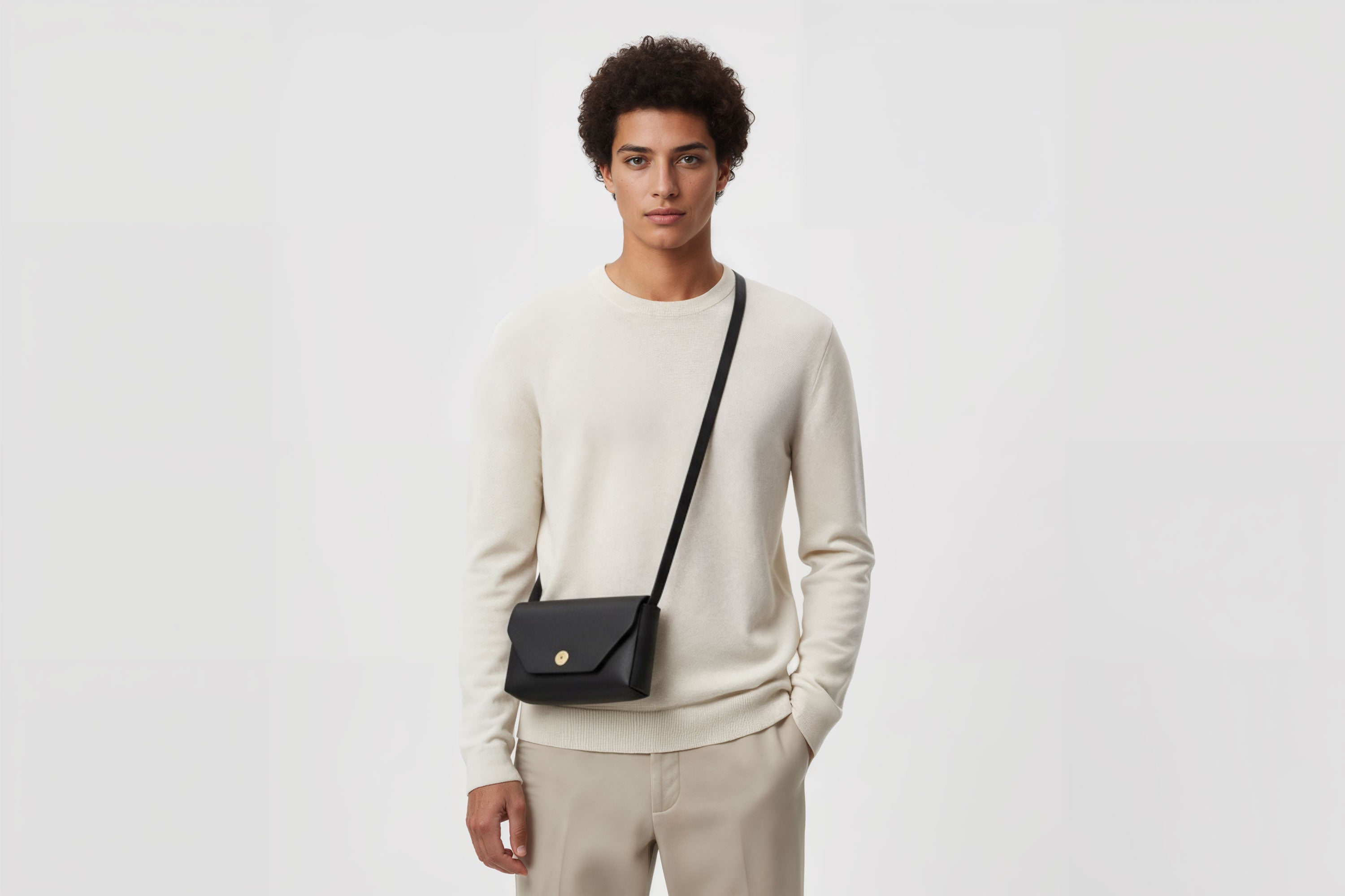 Brick Bag  Black Color Leather On Man Model Bright Background Vegetable Tanned Leather Modern Minimalist Design Premium Quality Atelier Madre Manuel Dreesmann Barcelona Spain