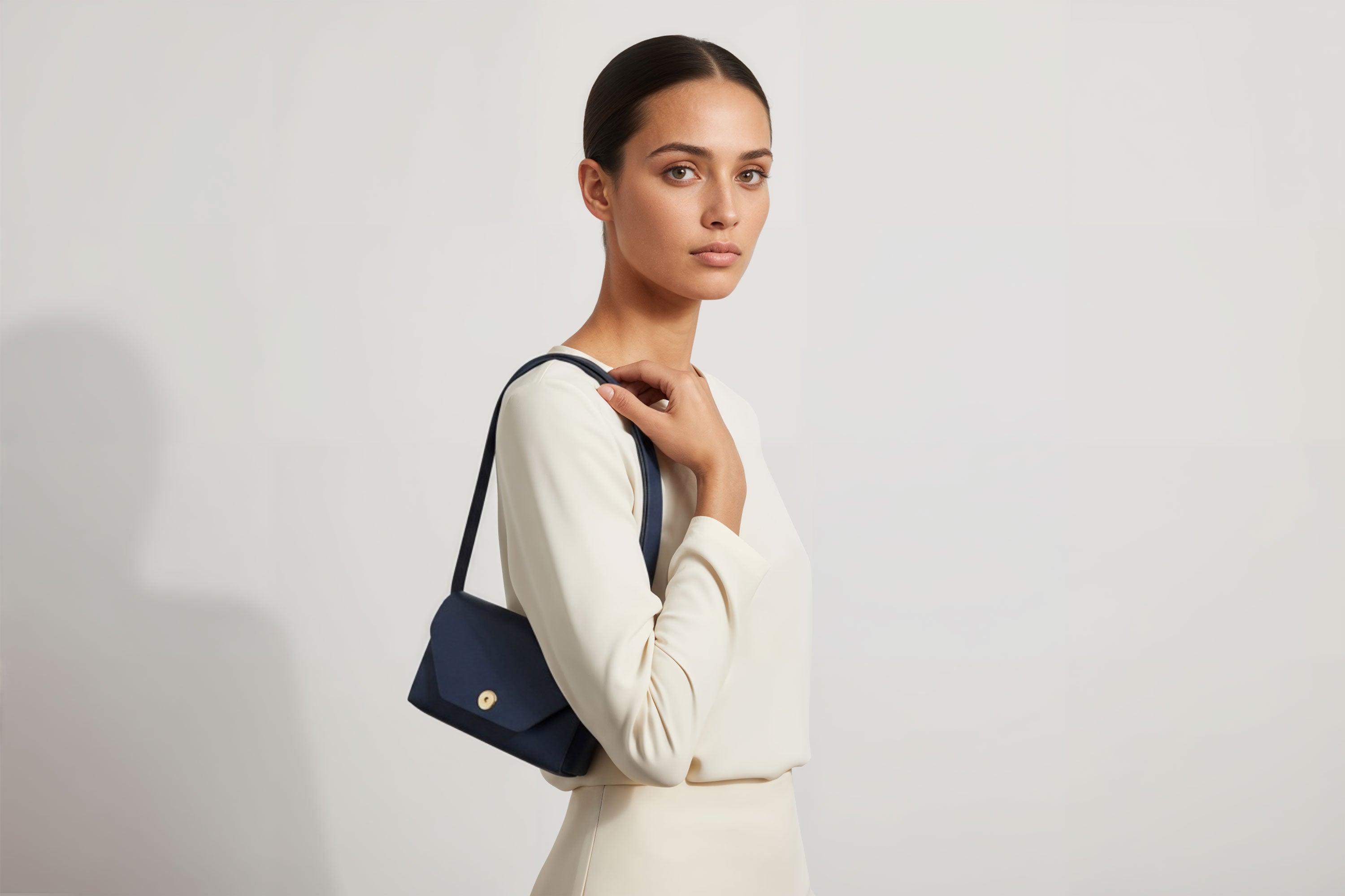 Brick Bag  Marine Blue Color Leather On Woman Model Bright Background Vegetable Tanned Leather Modern Minimalist Design Premium Quality Atelier Madre Manuel Dreesmann Barcelona Spain