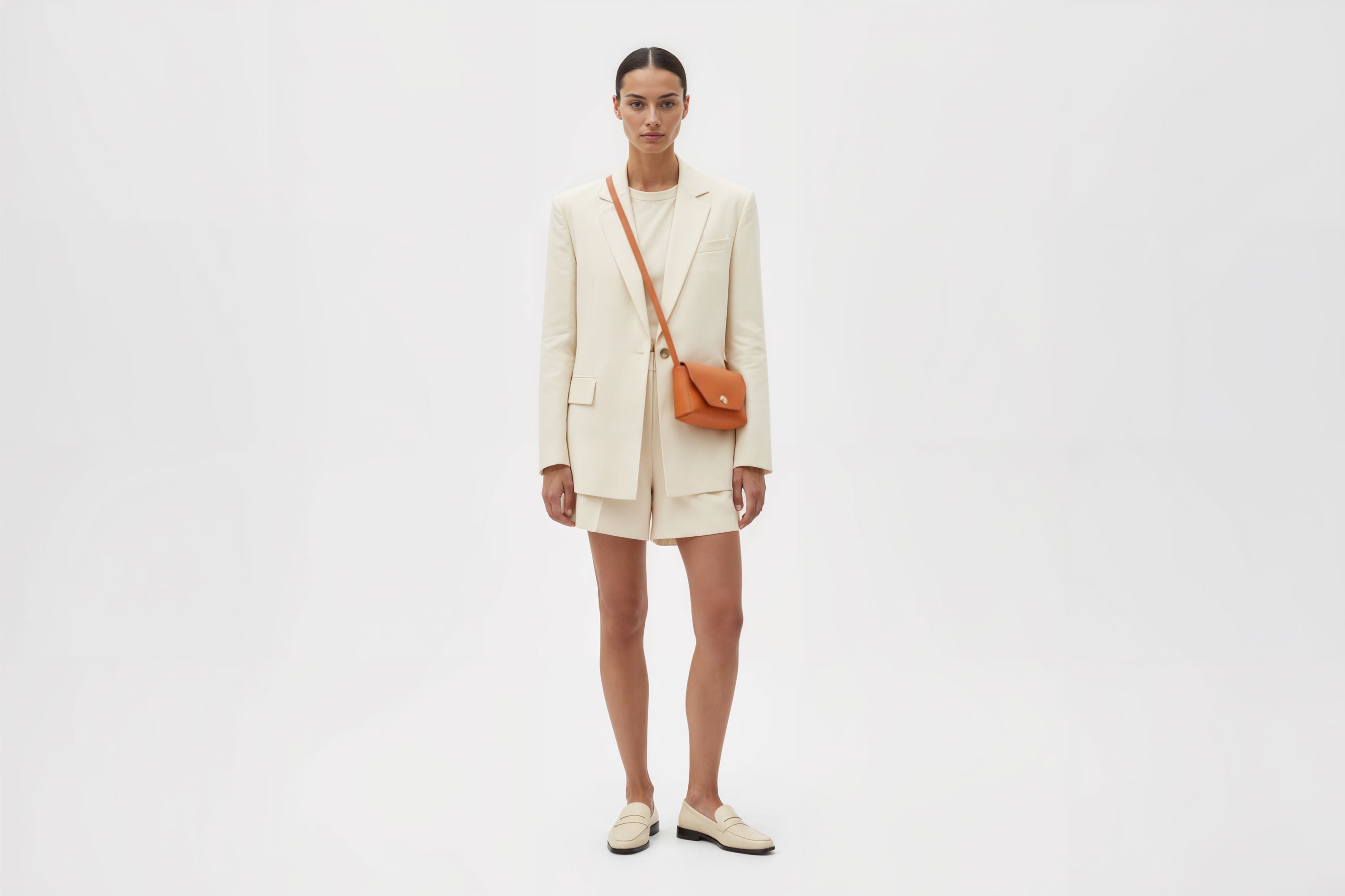 Brick Bag Orange Color Leather On Woman Model Bright Background Vegetable Tanned Leather Modern Minimalist Design Premium Quality Atelier Madre Manuel Dreesmann Barcelona Spain