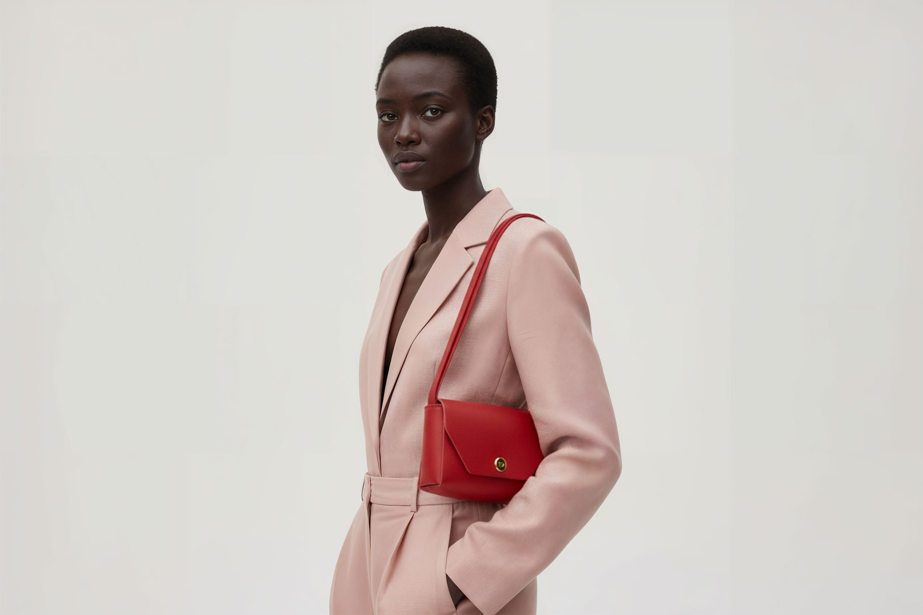 Brick Bag Red Color Leather On Woman Model Bright Background Vegetable Tanned Leather Modern Minimalist Design Premium Quality Atelier Madre Manuel Dreesmann Barcelona Spain