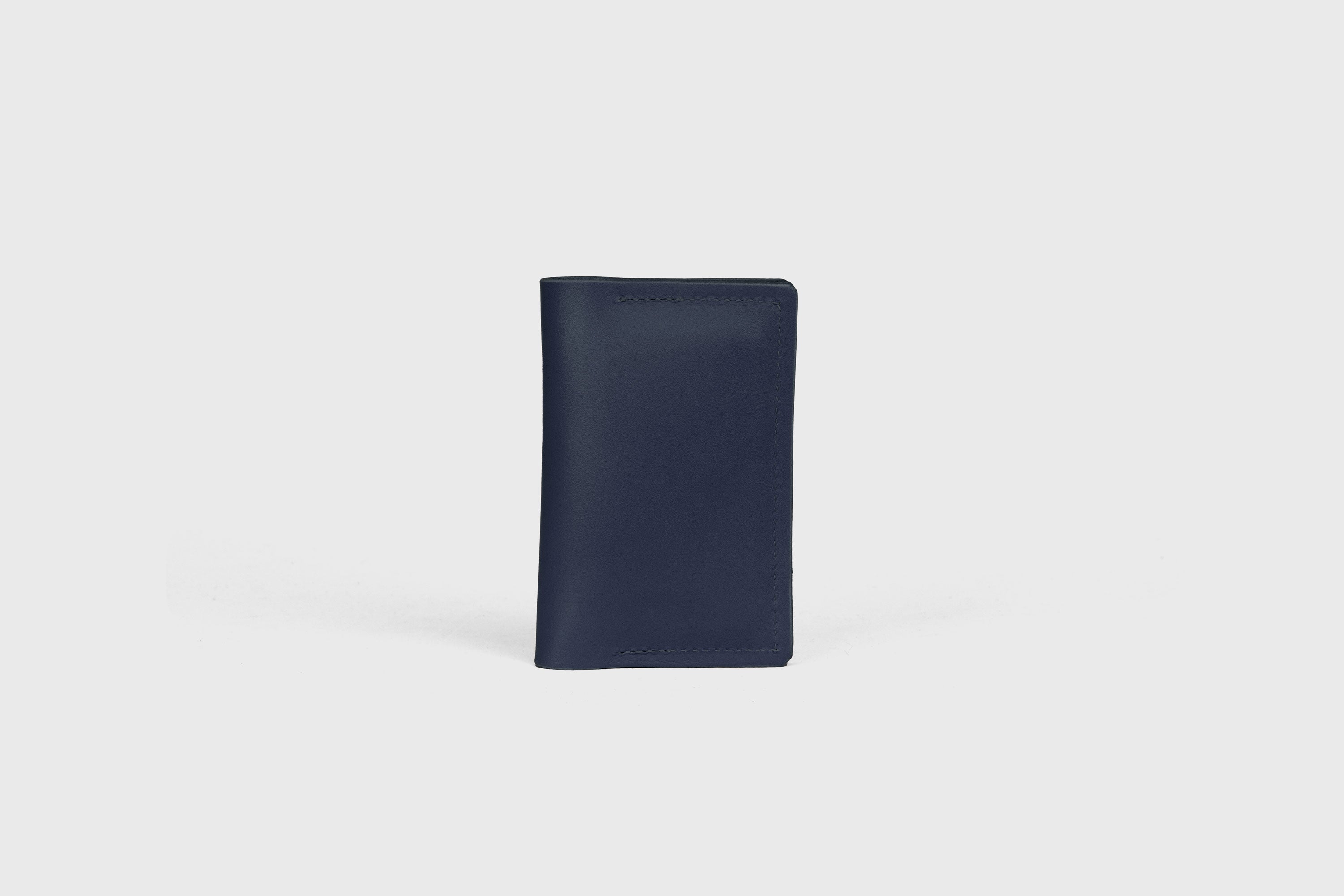 Card Etui In Marine Blue Color In Vegetable Tanned Leather Minimalistic Design With Snap Buttons Atelier Madre Manuel Dreesmann Barcelona Spain
