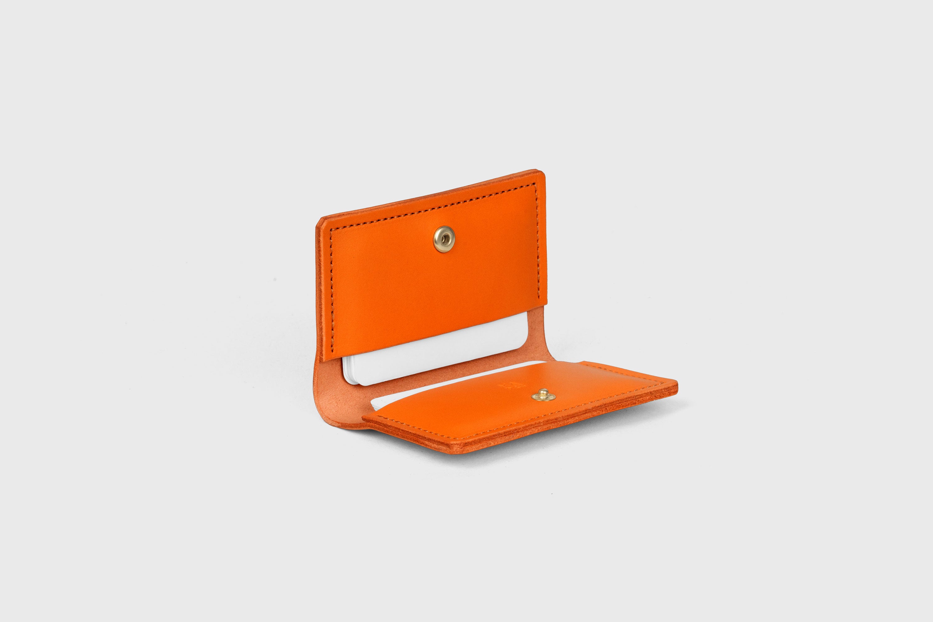 Card Etui In Orange Color In Vegetable Tanned Leather Minimalistic Design With Snap Buttons Atelier Madre Manuel Dreesmann Barcelona Spain