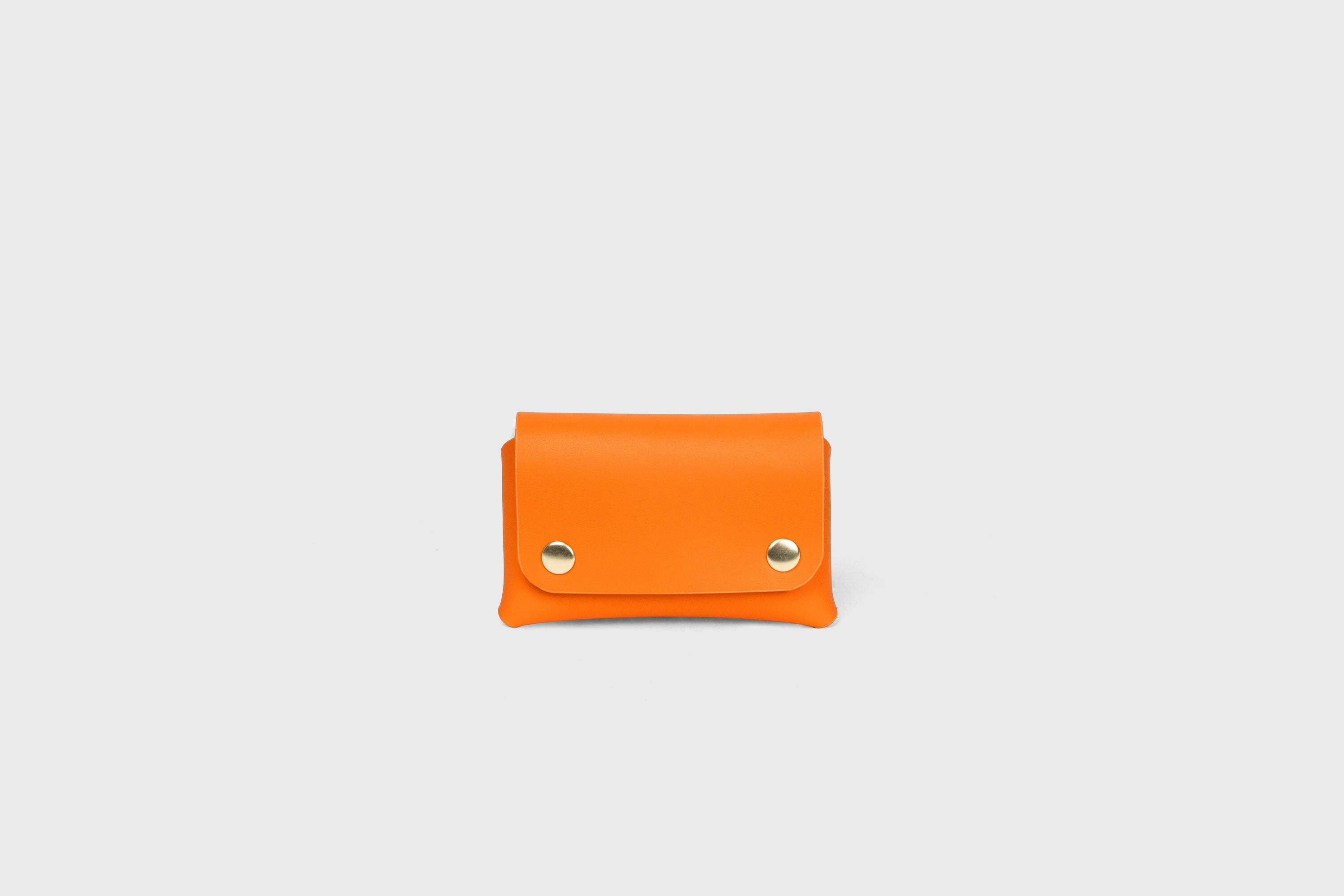 Card Holder With Snap Buttons In Orange Leather Minimalistic Design Leather Atelier Madre Manuel Dreesmann