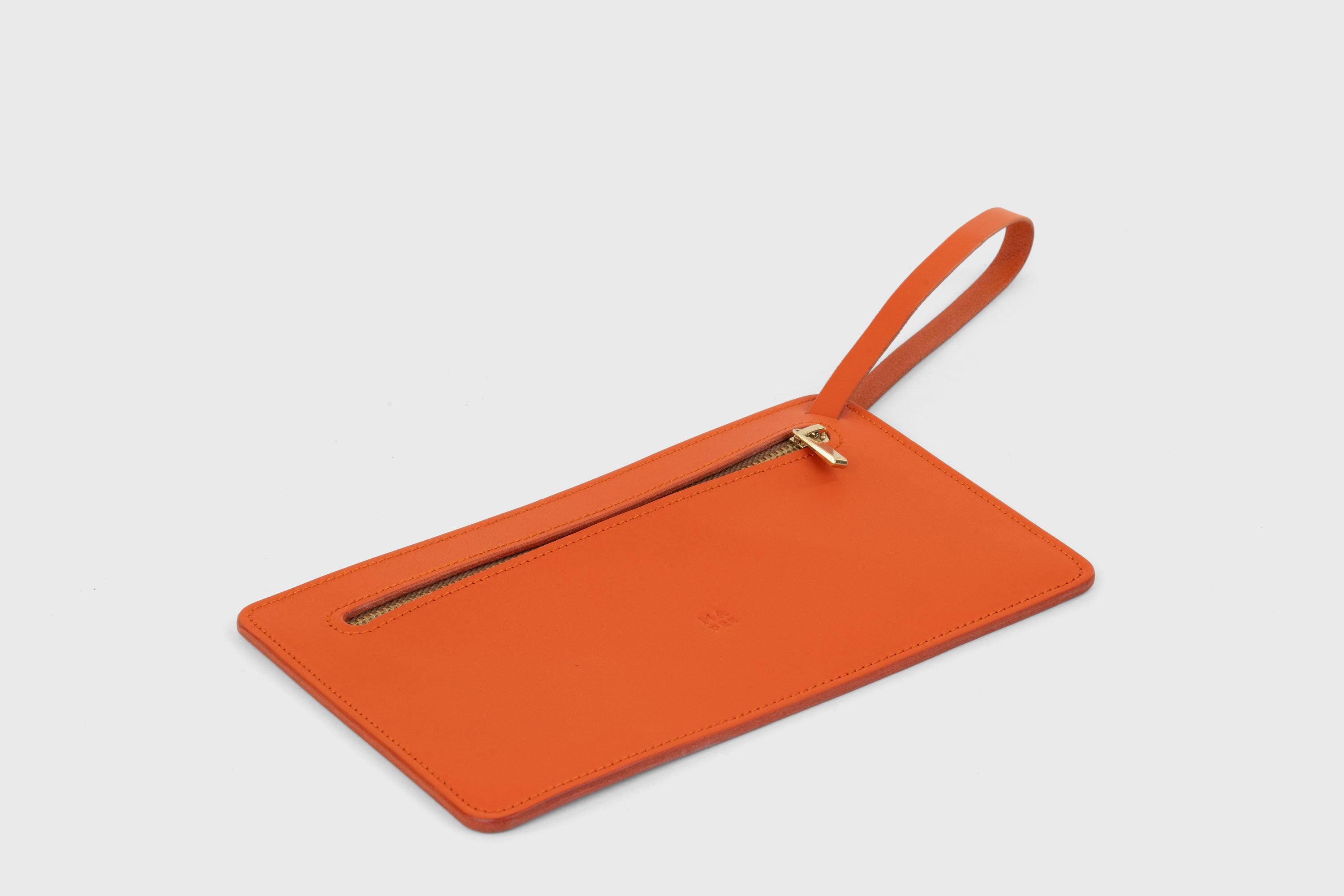 Clutch Flat Leather Orange Bag Slim Wrist Band Zipper Minimalistic Premium Handmade Design Atelier Madre Manuel Dreesmann Barcelona Spain