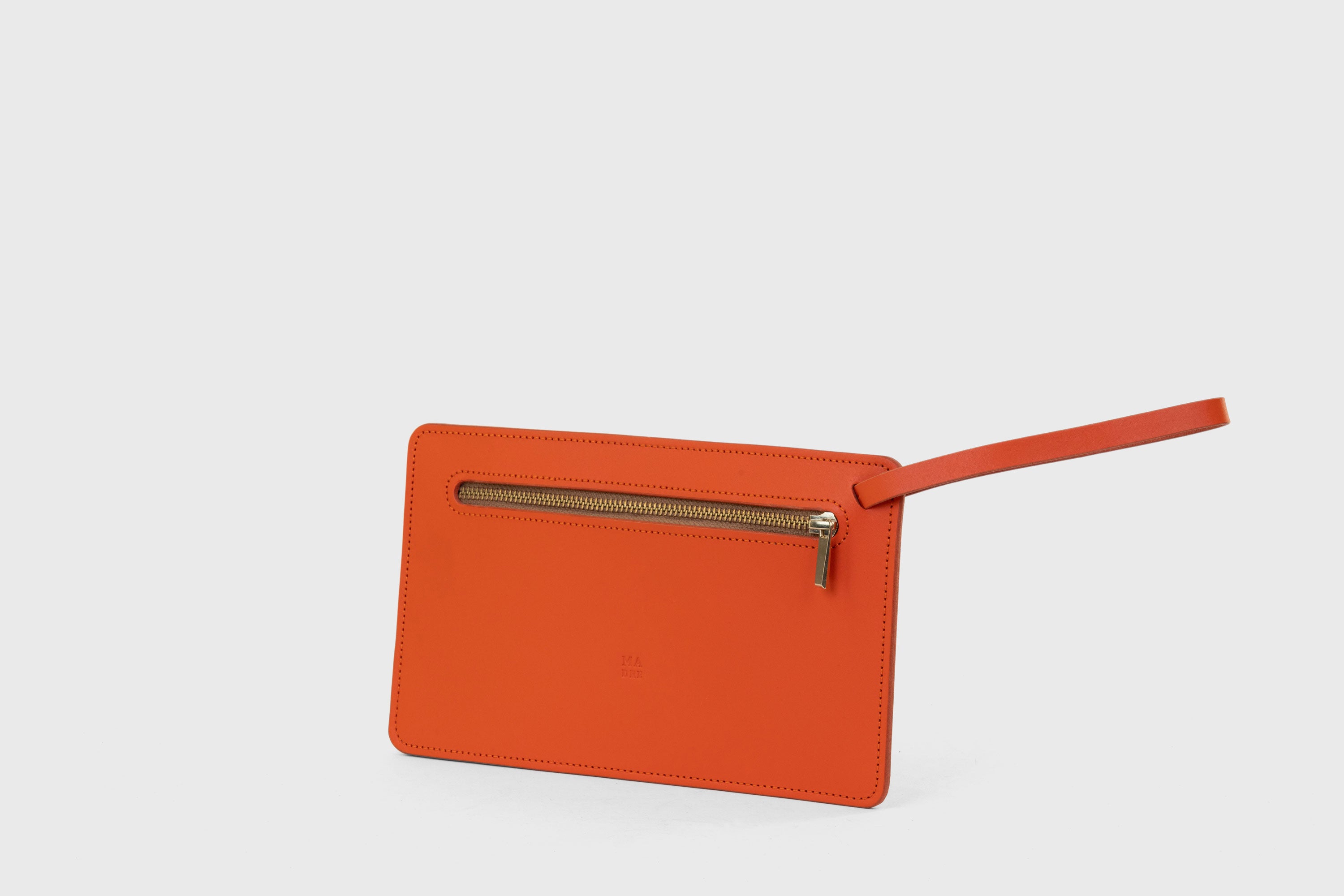 Clutch Flat Leather Orange Bag Slim Wrist Band Zipper Minimalistic Premium Handmade Design Atelier Madre Manuel Dreesmann Barcelona Spain