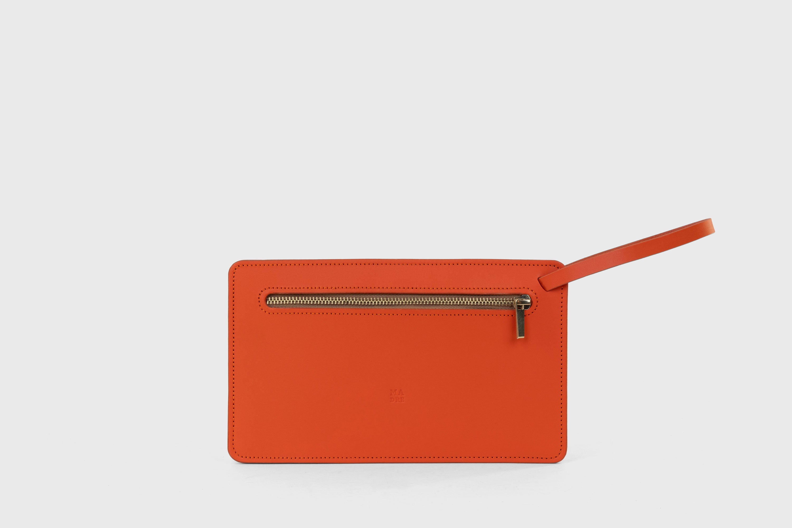 Clutch Flat Leather Orange Bag Slim Wrist Band Zipper Minimalistic Premium Handmade Design Atelier Madre Manuel Dreesmann Barcelona Spain