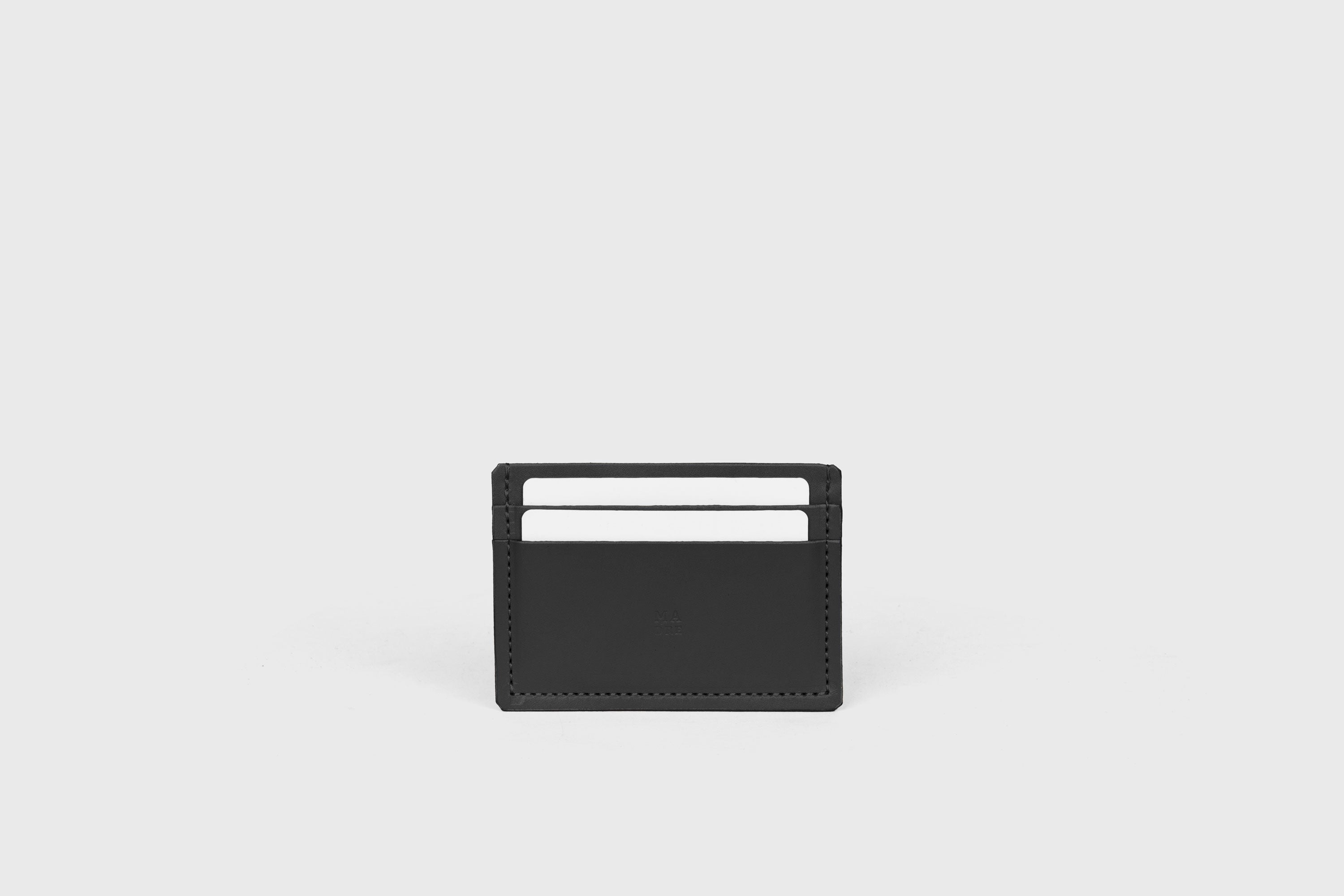 Credit Card Wallet Minimalist In Black Color Leather Vegetable Tanned Leather Handmade and Design by Atelier Madre Manuel Dreesmann Barcelona Spain