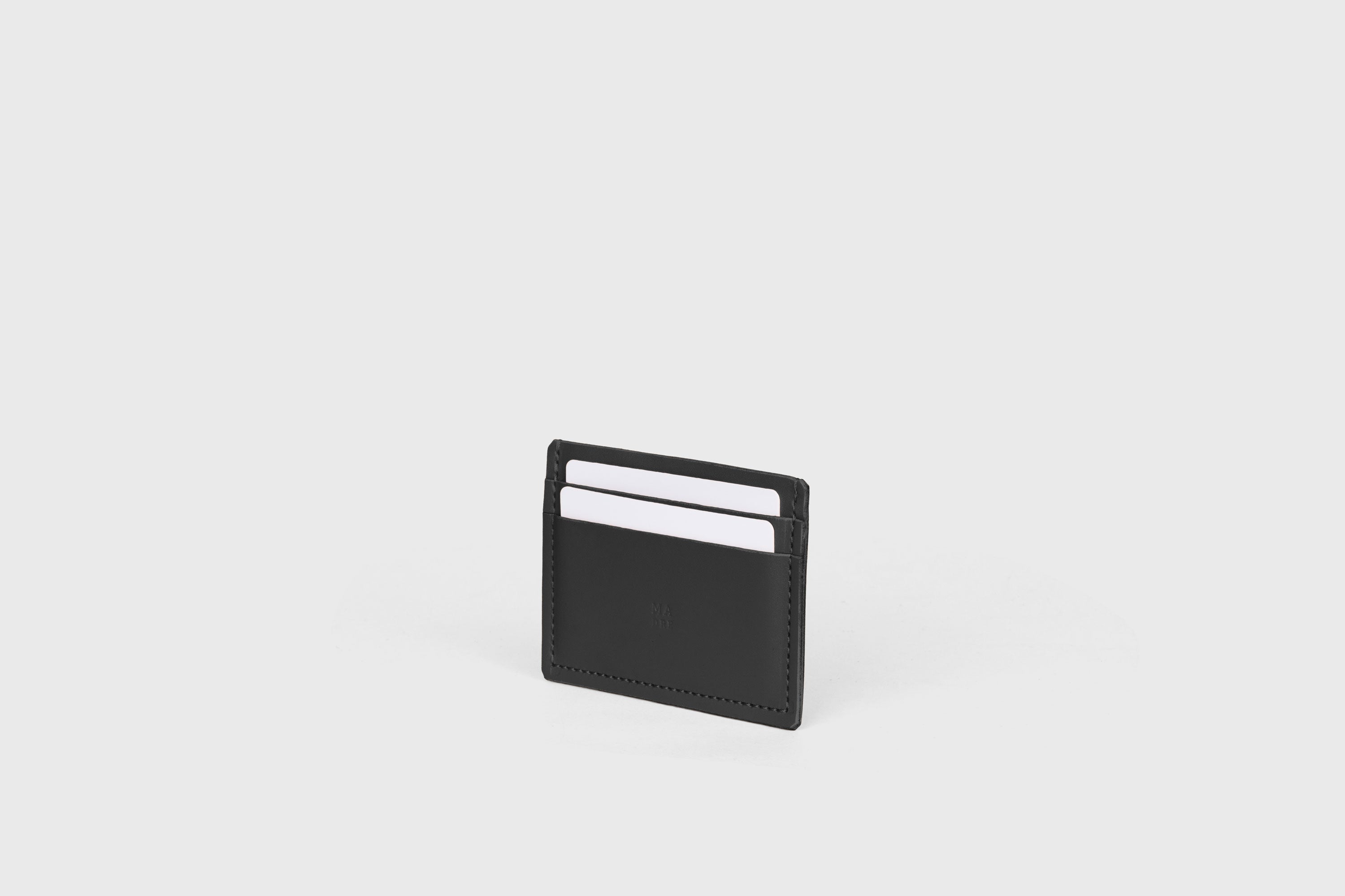 Credit Card Wallet Minimalist In Black Color Leather Vegetable Tanned Leather Handmade and Design by Atelier Madre Manuel Dreesmann Barcelona Spain