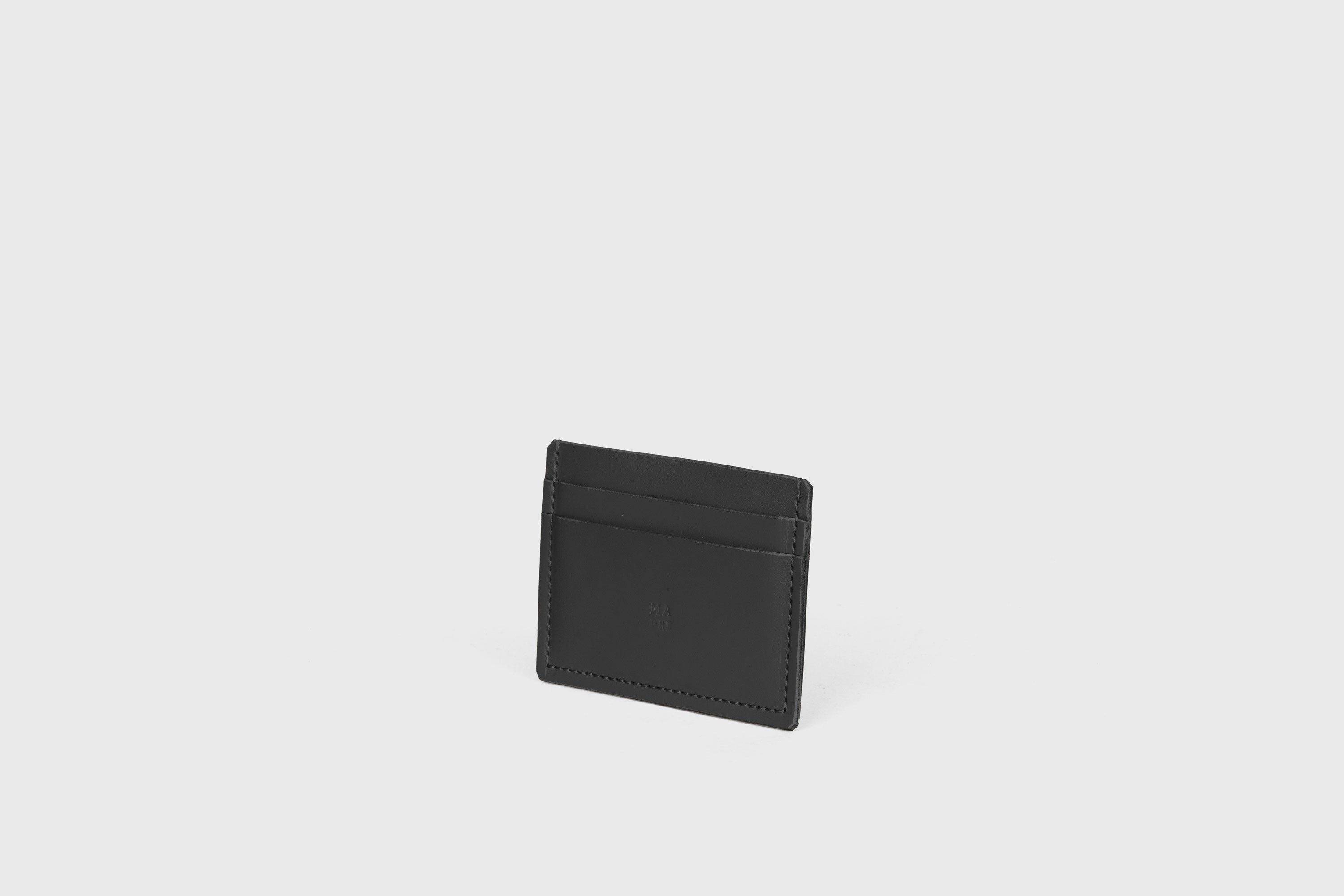 Credit Card Wallet Minimalist In Black Color Leather Vegetable Tanned Leather Handmade and Design by Atelier Madre Manuel Dreesmann Barcelona Spain