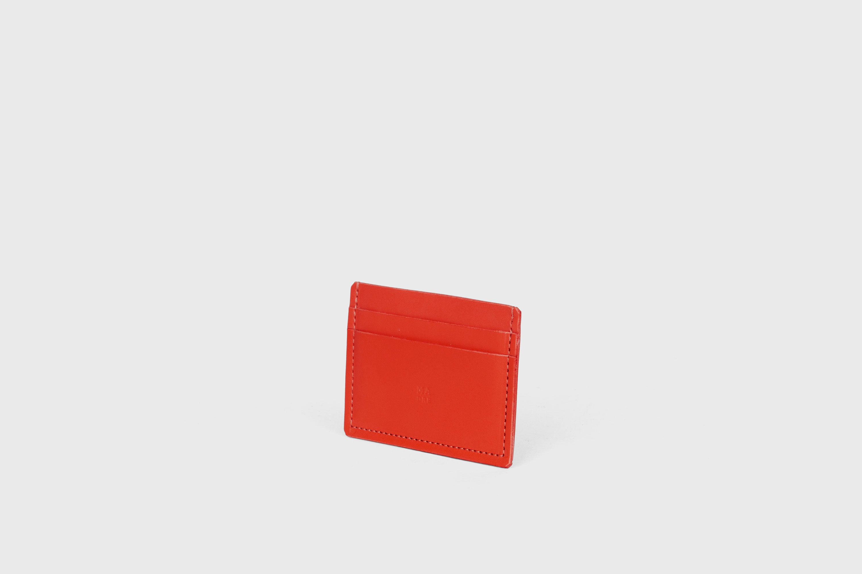 Credit Card Wallet Minimalist In Red Color Leather Vegetable Tanned Leather Handmade and Design by Atelier Madre Manuel Dreesmann Barcelona Spain
