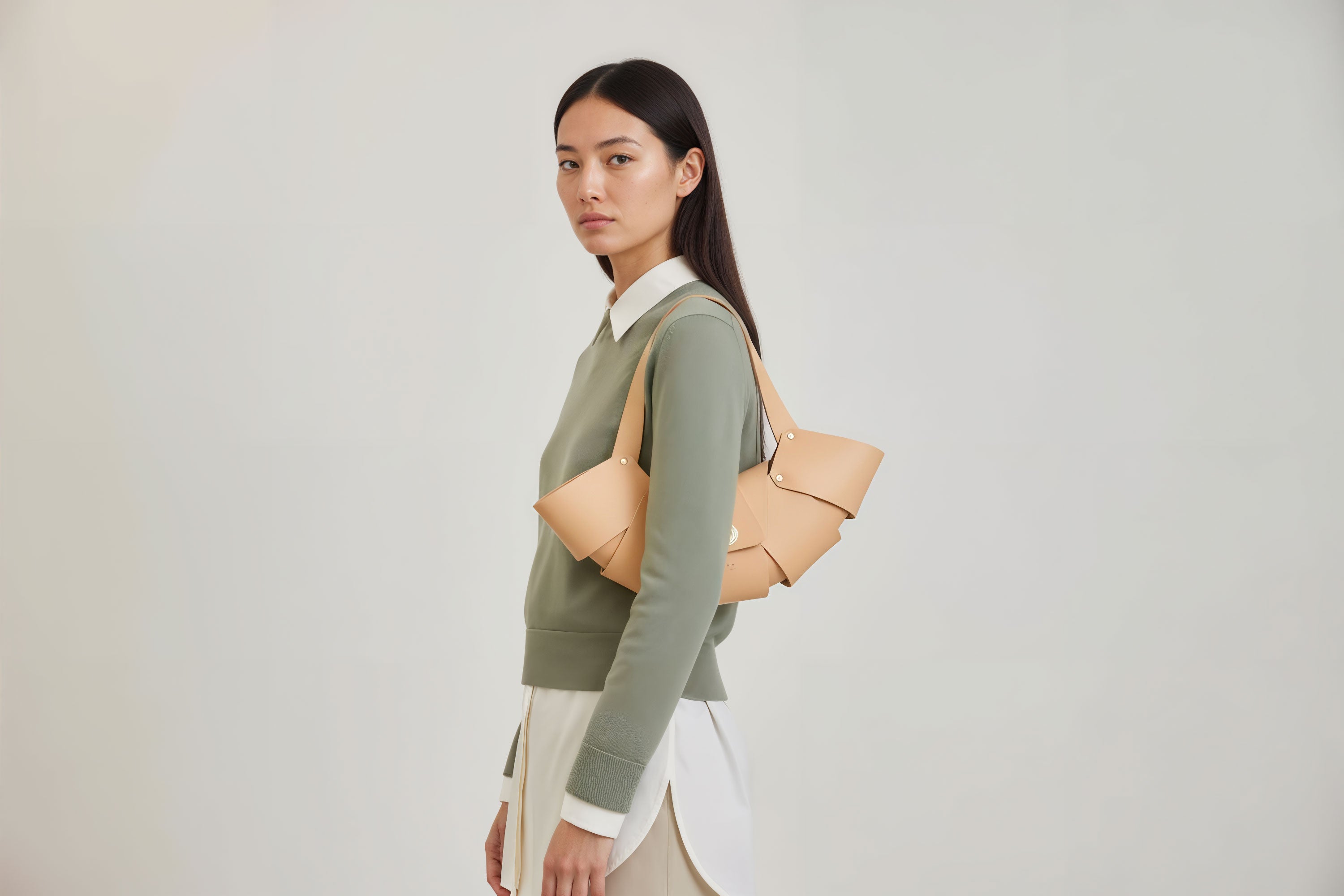 Croissant Bag Natural Color Leather Minimalistic Design On Model White Background Atelier Madre Manuel Dreesmann Barcelona