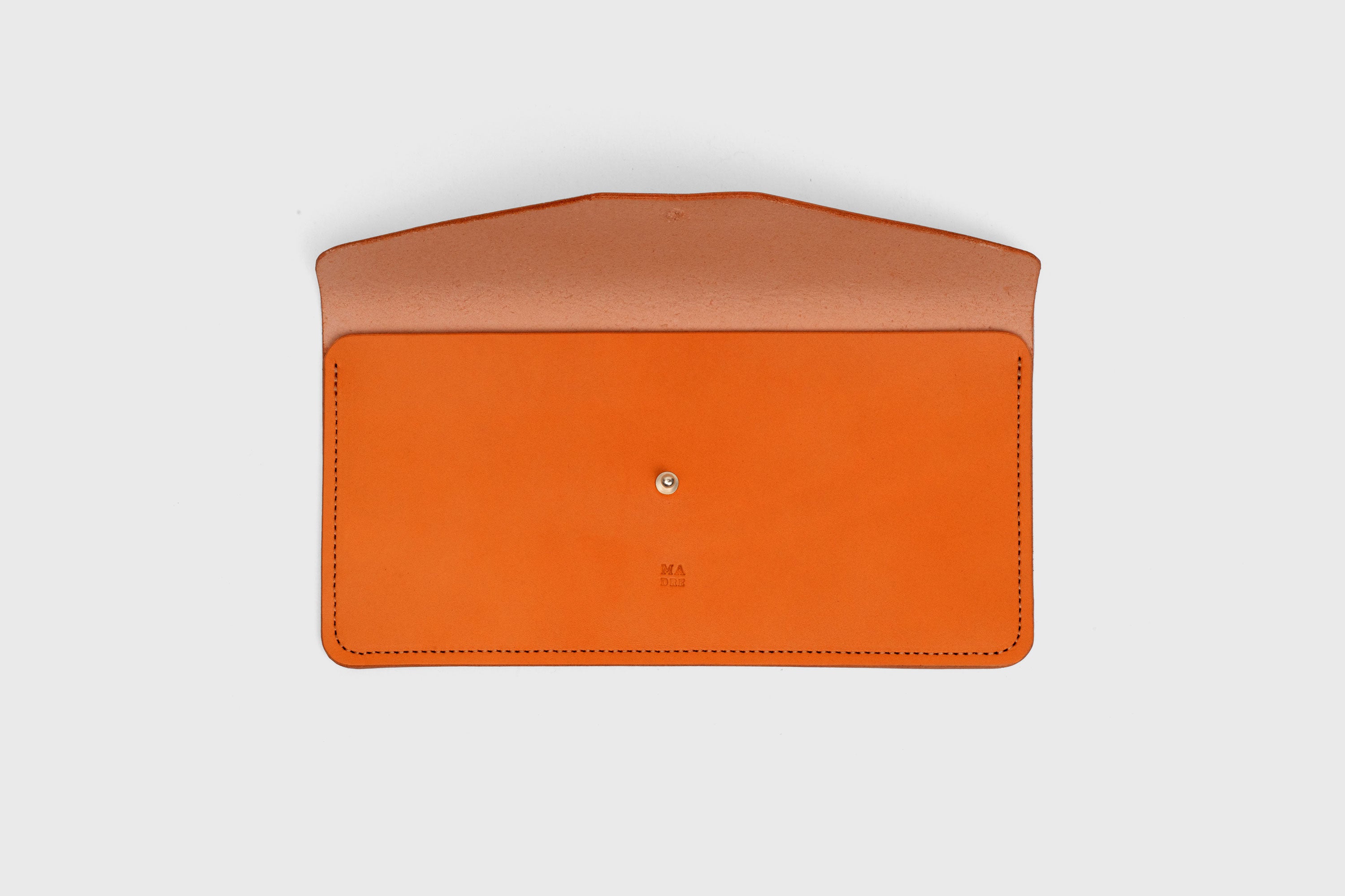 Document Holder In Orange Color In Vegetable Tanned Leather Minimalistic Design Atelier Madre Manuel Dreesmann Barcelona Spain