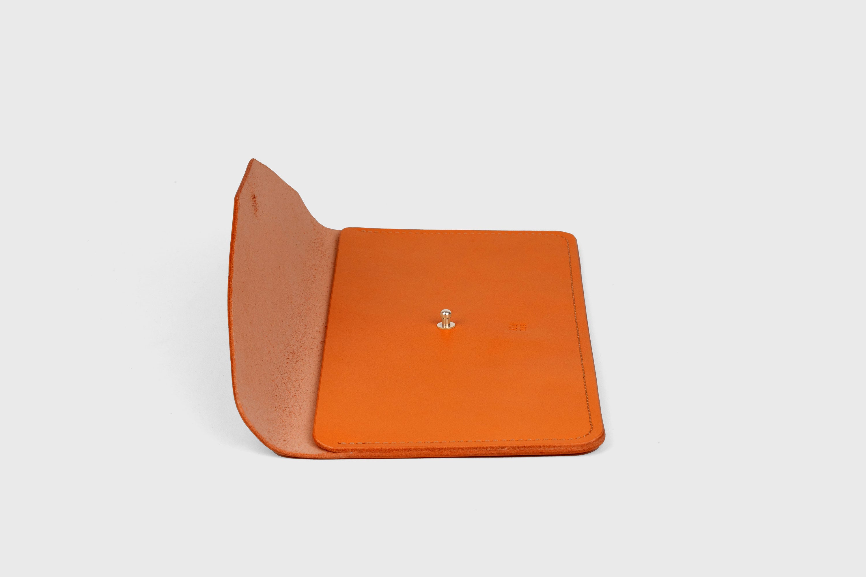 Document Holder In Orange Color In Vegetable Tanned Leather Minimalistic Design Atelier Madre Manuel Dreesmann Barcelona Spain