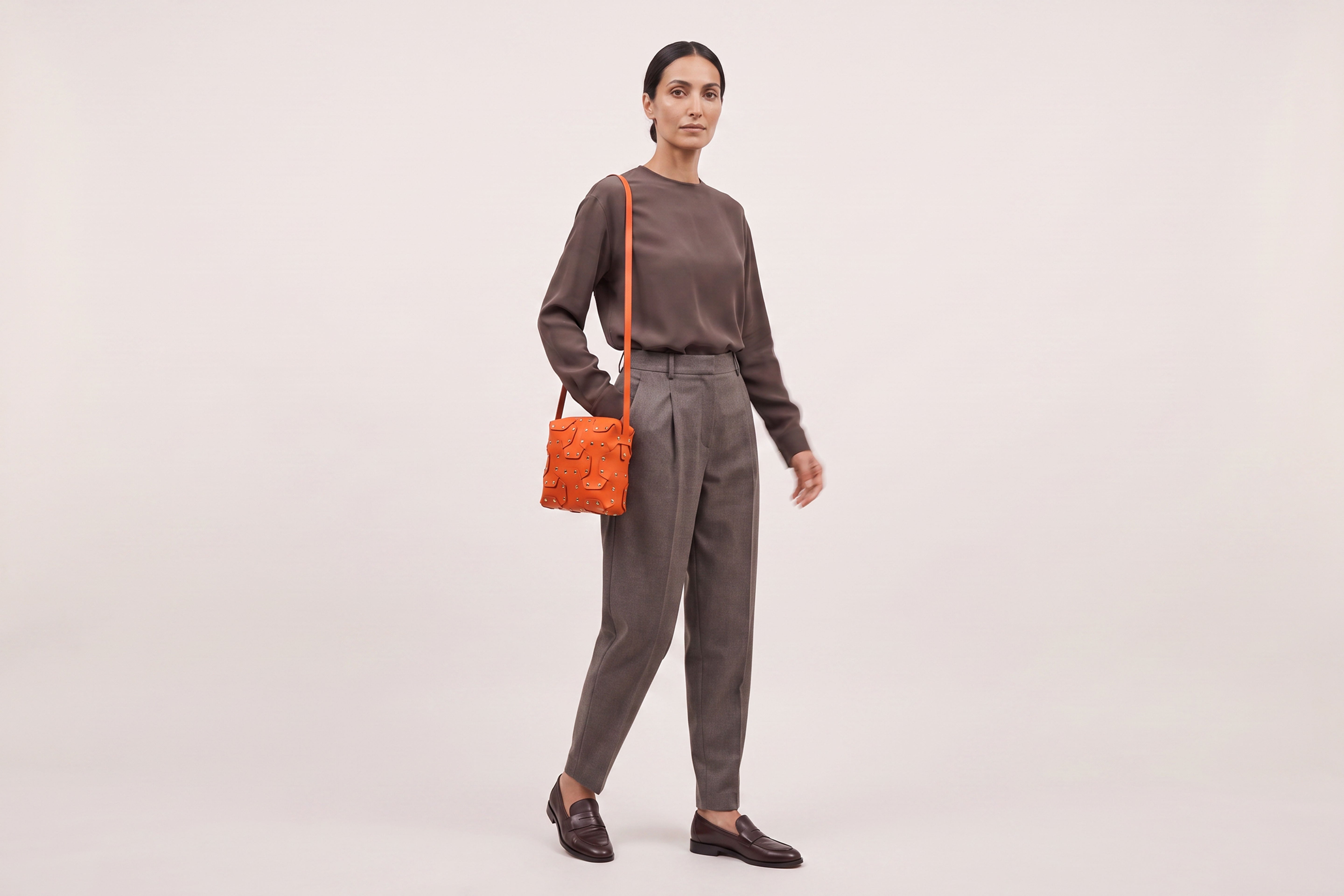 Double Rivet Bag Squared on a model, Orange Colour, Vegetable-Tanned Leather, Modern Minimal Design. Premium Quality, Atelier Madre, Manuel-Dreesmann, Barcelona