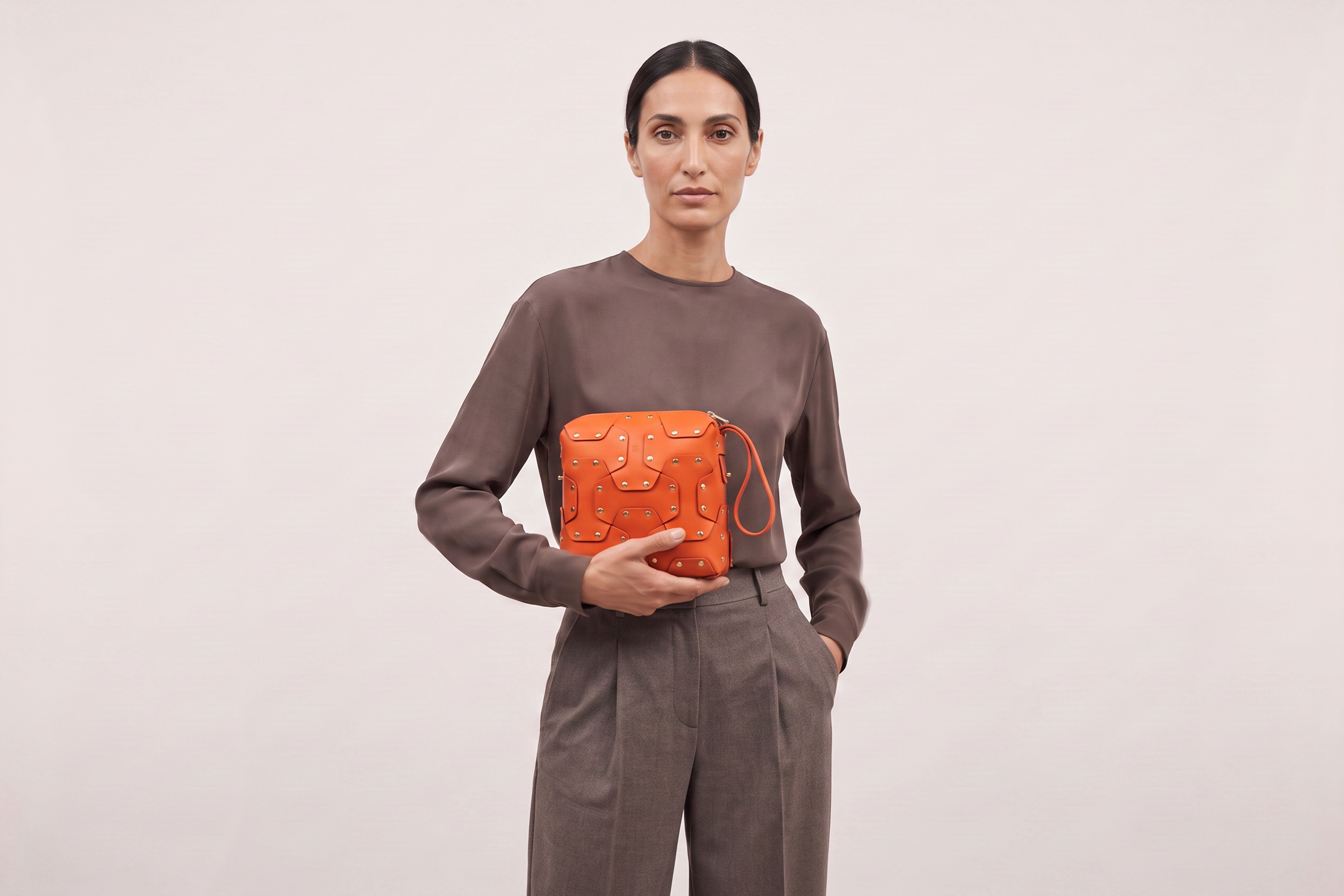 Double Rivet Bag Squared on a model, Orange Colour, Vegetable-Tanned Leather, Modern Minimal Design. Premium Quality, Atelier Madre, Manuel-Dreesmann, Barcelona