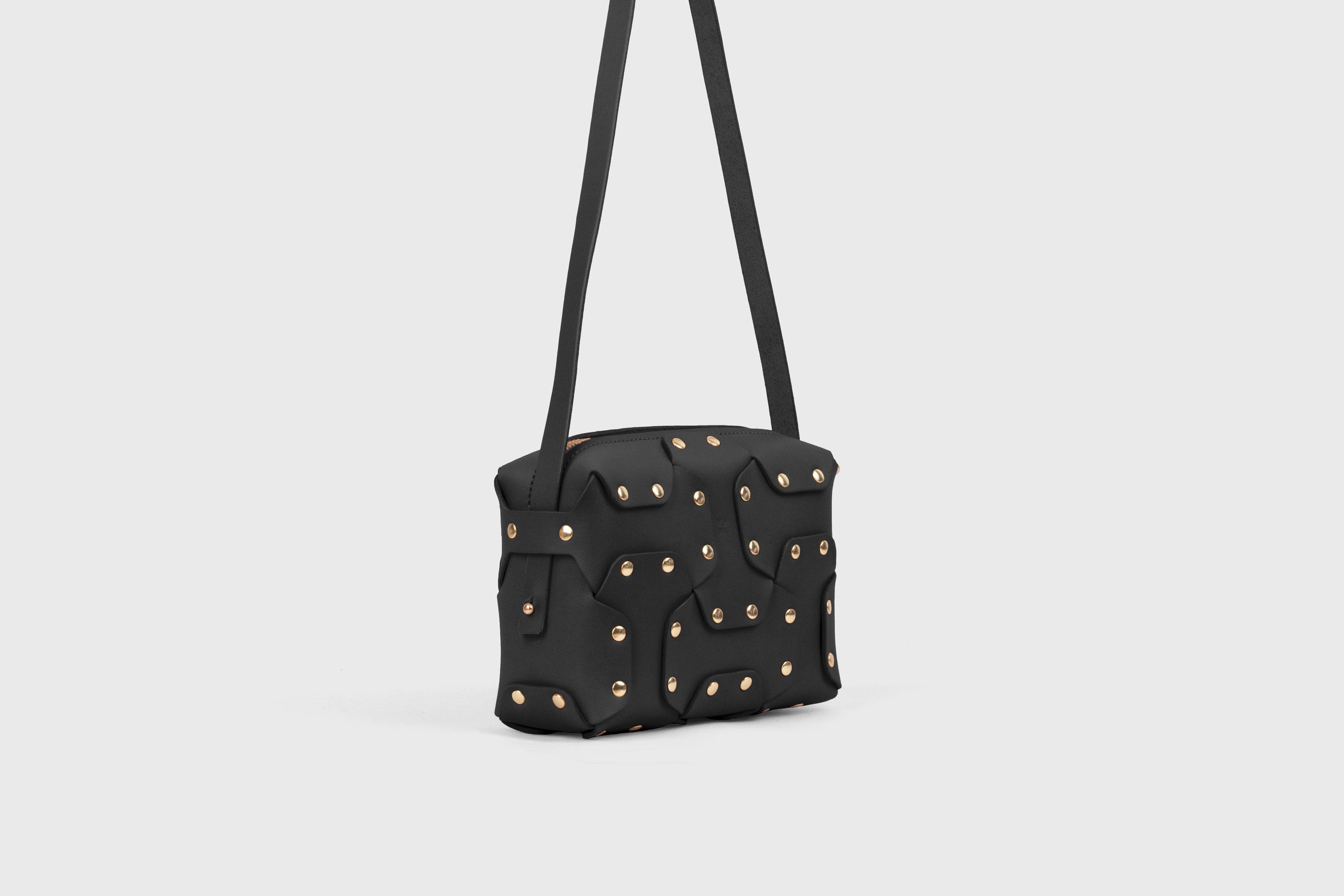Double Rivet Bag, Black Color,  Leather Full Grain Vegetable Tanned Leather Modern Minimalist Design Premium Quality Full Brass Clutch Crossbody Shoulder Bag from Atelier Madre, Manuel Dreesmann Barcelona Spain