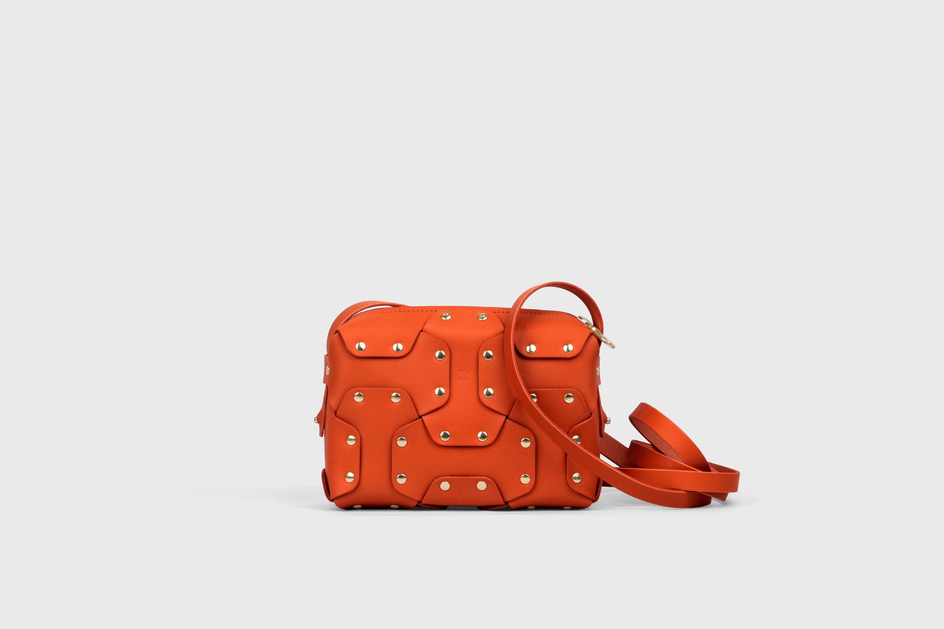 Double Rivet Bag, Orange Color,  Leather Full Grain Vegetable Tanned Leather Modern Minimalist Design Premium Quality Full Brass Clutch Crossbody Shoulder Bag from Atelier Madre, Manuel Dreesmann Barcelona Spain