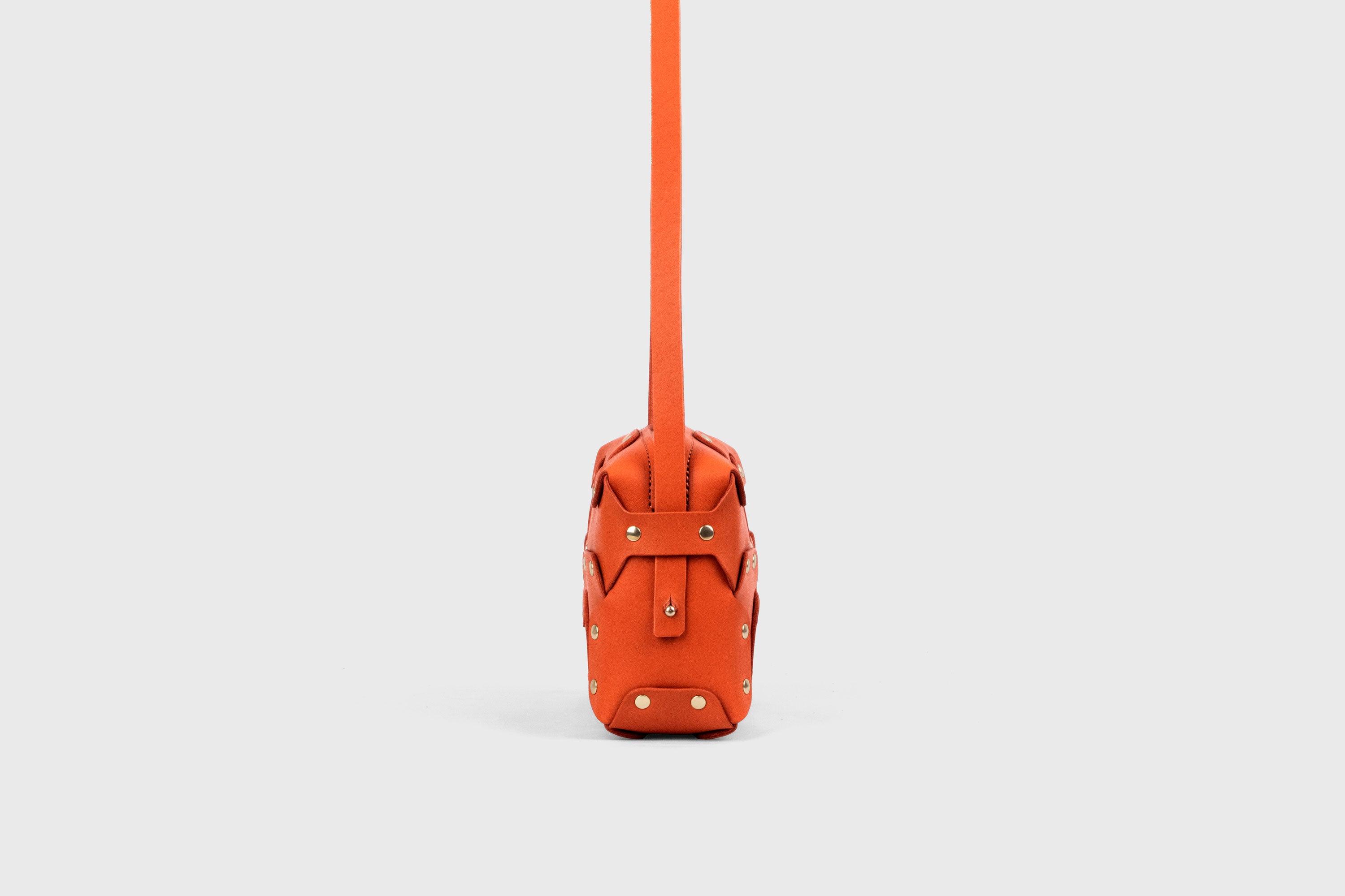 Double Rivet Bag, Orange Color,  Leather Full Grain Vegetable Tanned Leather Modern Minimalist Design Premium Quality Full Brass Clutch Crossbody Shoulder Bag from Atelier Madre, Manuel Dreesmann Barcelona Spain