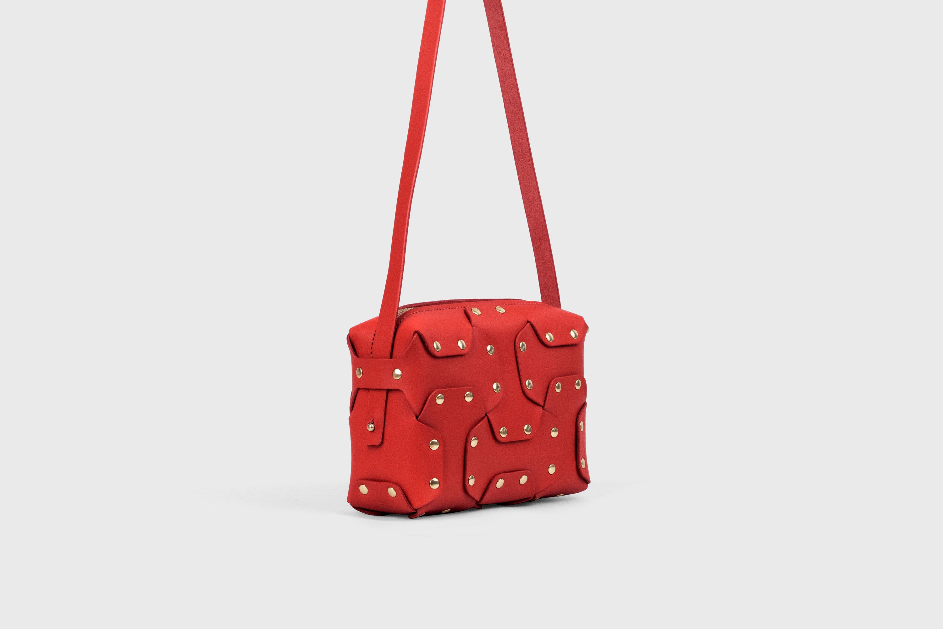 Double Rivet Bag, Red Color,  Leather Full Grain Vegetable Tanned Leather Modern Minimalist Design Premium Quality Full Brass Clutch Crossbody Shoulder Bag from Atelier Madre, Manuel Dreesmann Barcelona Spain