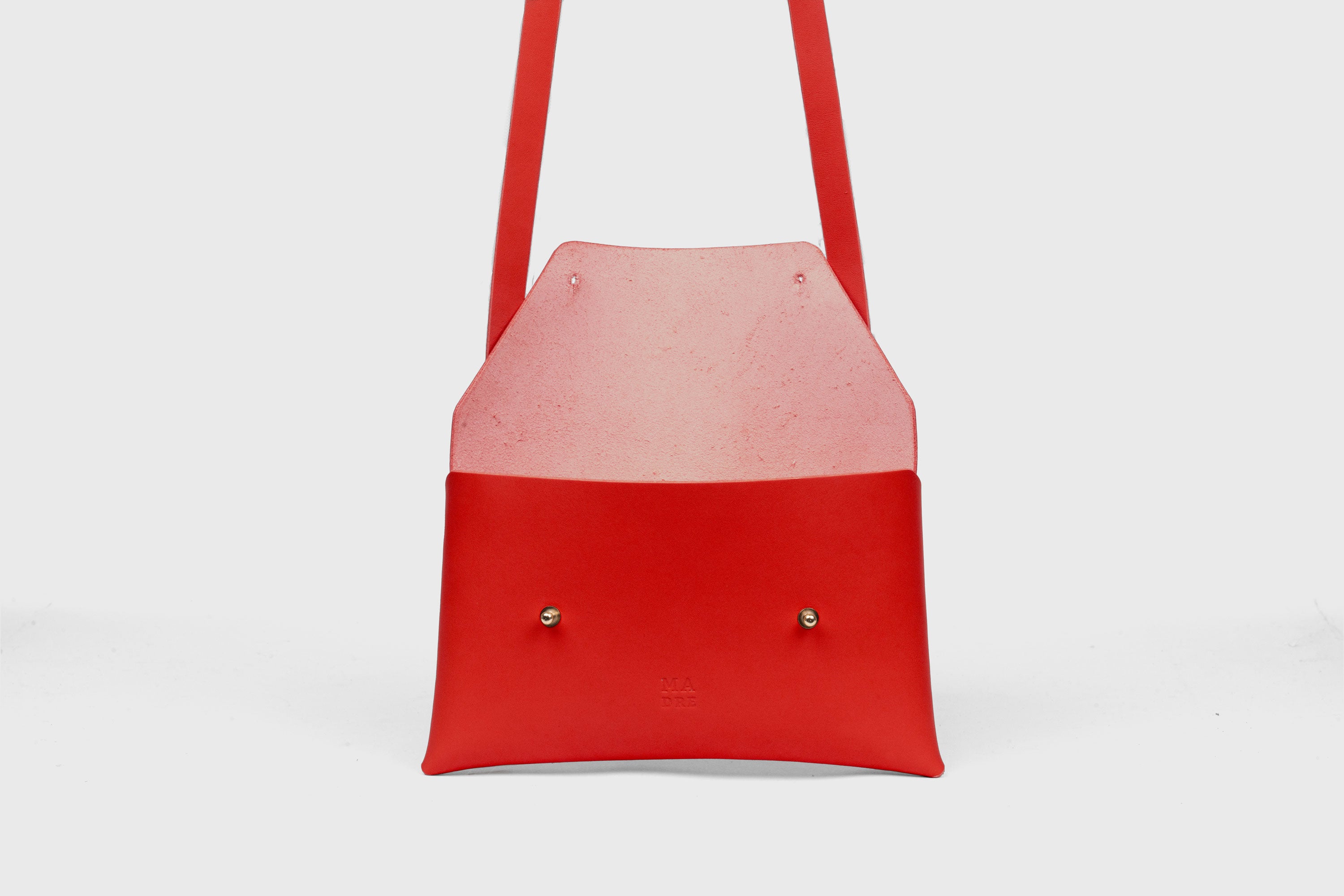 Envelope Bag With a Strap In Red Color Vegetable Tanned Leather Minimalistic Design Atelier Madre Manuel Dreesmann Barcelona Spain