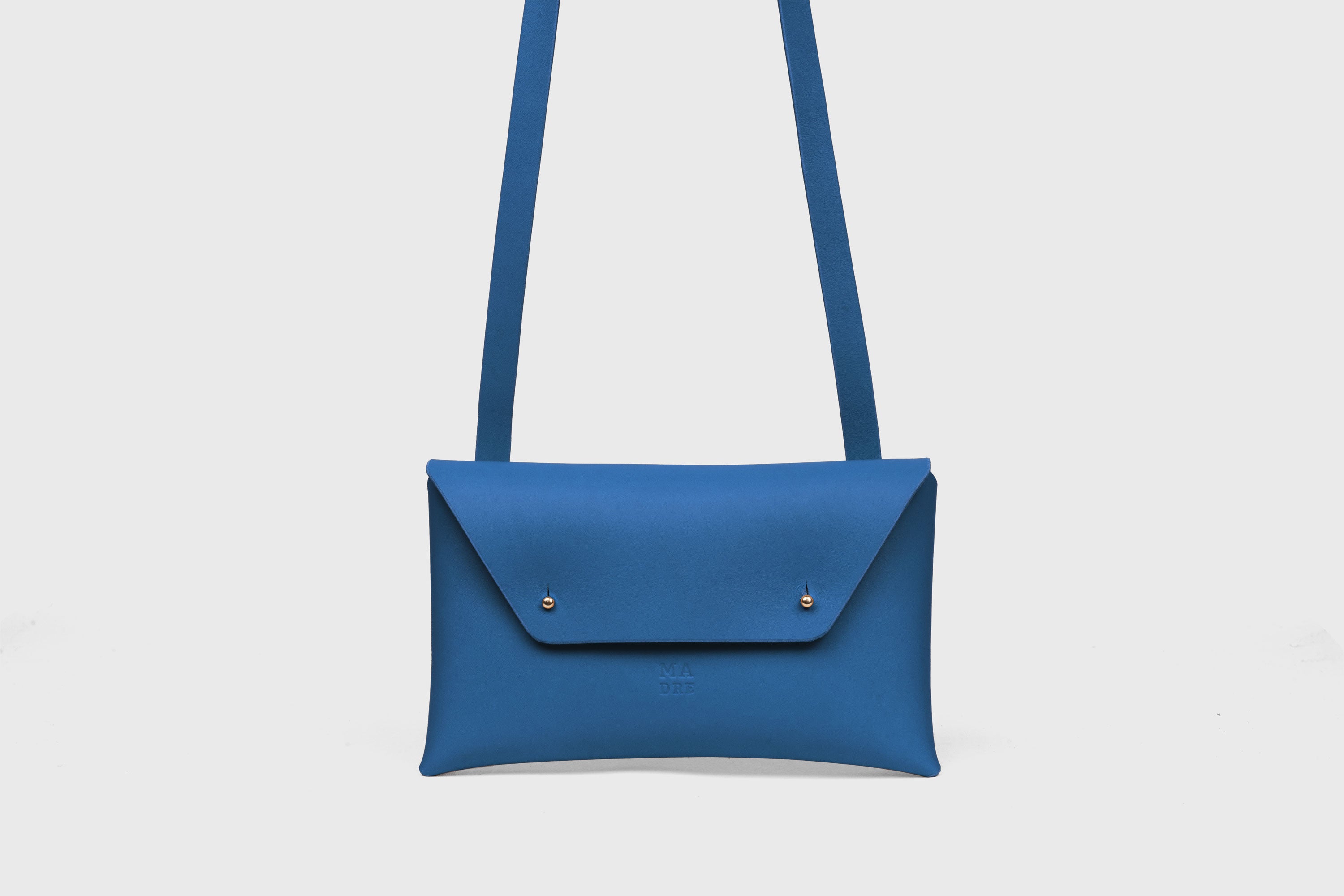 Envelope Bag With a Strap In Royal Blue Color Vegetable Tanned Leather Minimalistic Design Atelier Madre Manuel Dreesmann Barcelona Spain