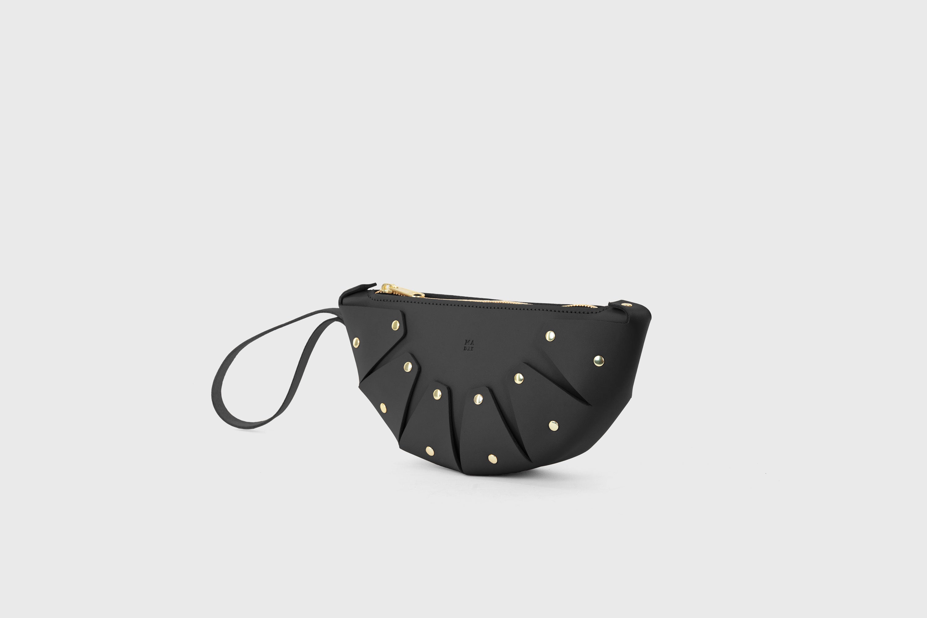 Juno Leather Bag Black Color Vegetable Tanned Full Grain Spain Brass Rivets Design Minimalist Half Moon Circle Round Zipper Pouch Handbag Clutch Bag Atelier Madre Manuel Dreesmann Barcelona