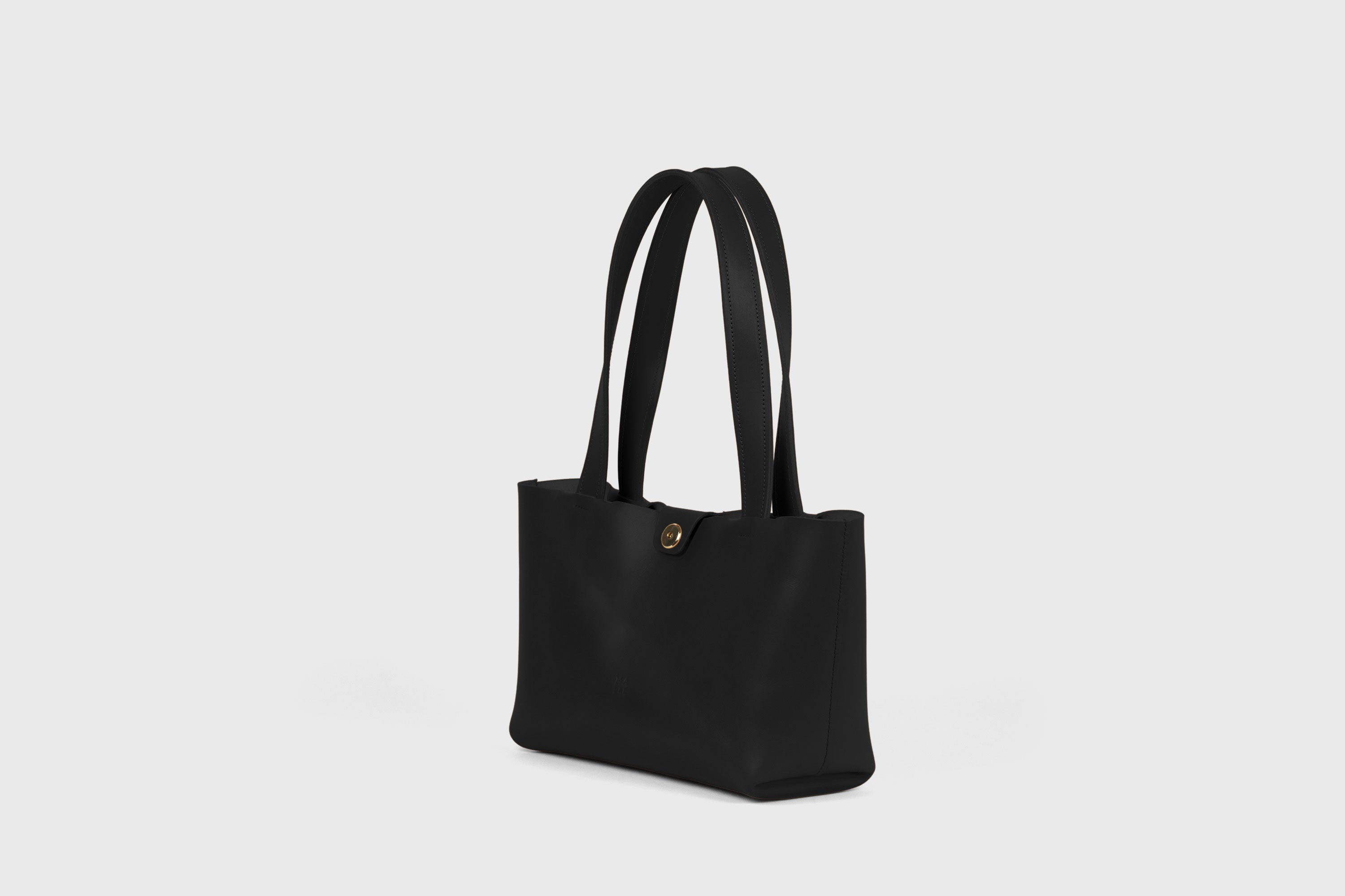 Karin Bag Closure In Black Color In Vegetable Tanned Leather Magnetic Closure Open Top Minimalistic Design Barcelona Spain