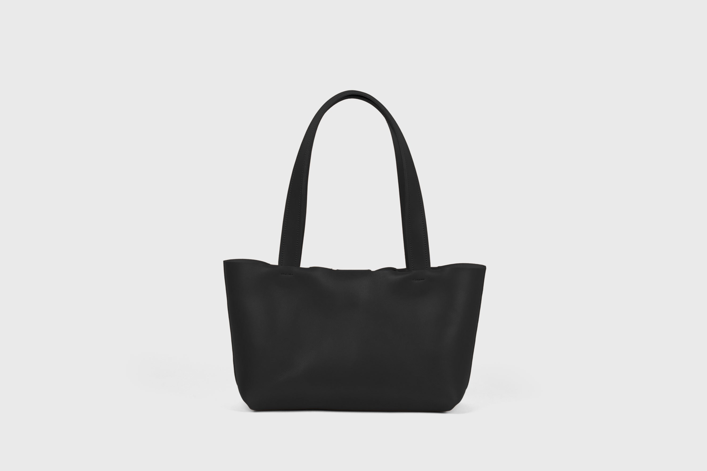 Karin Bag Closure In Black Color In Vegetable Tanned Leather Magnetic Closure Open Top Minimalistic Design Barcelona Spain
