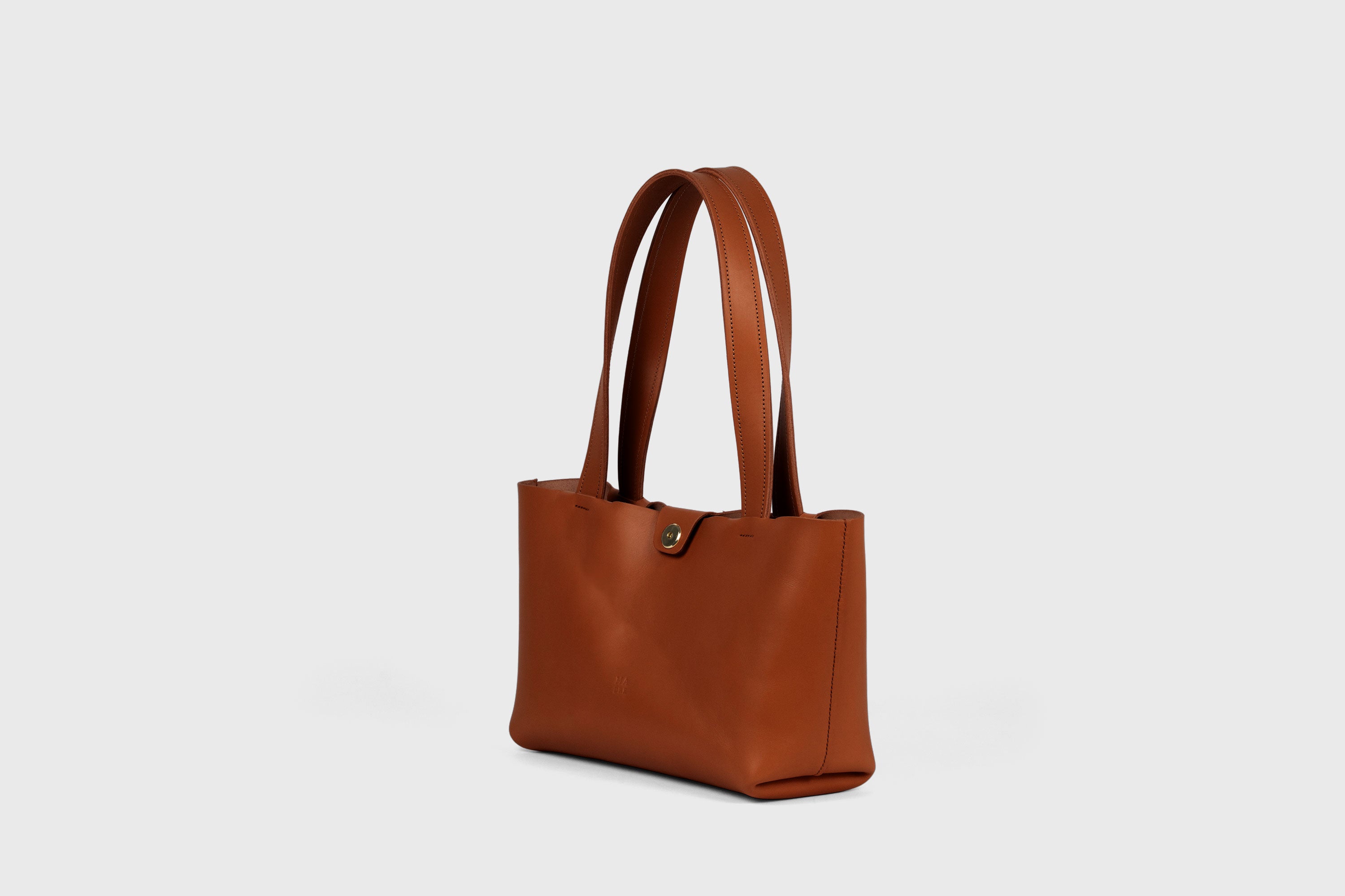 Karin Bag Closure In Dark Brown Color In Vegetable Tanned Leather Magnetic Closure Open Top Minimalistic Design Barcelona Spain