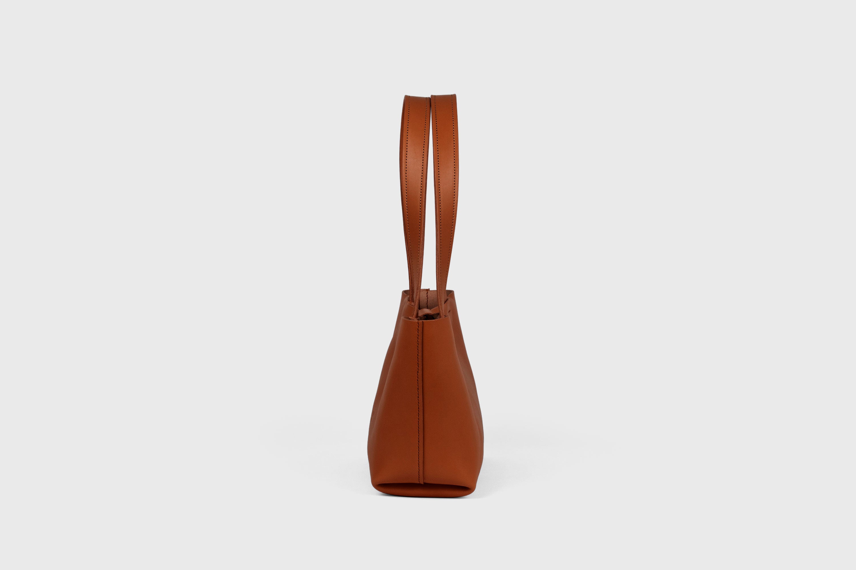 Karin Bag Closure In Dark Brown Color In Vegetable Tanned Leather Magnetic Closure Open Top Minimalistic Design Barcelona Spain