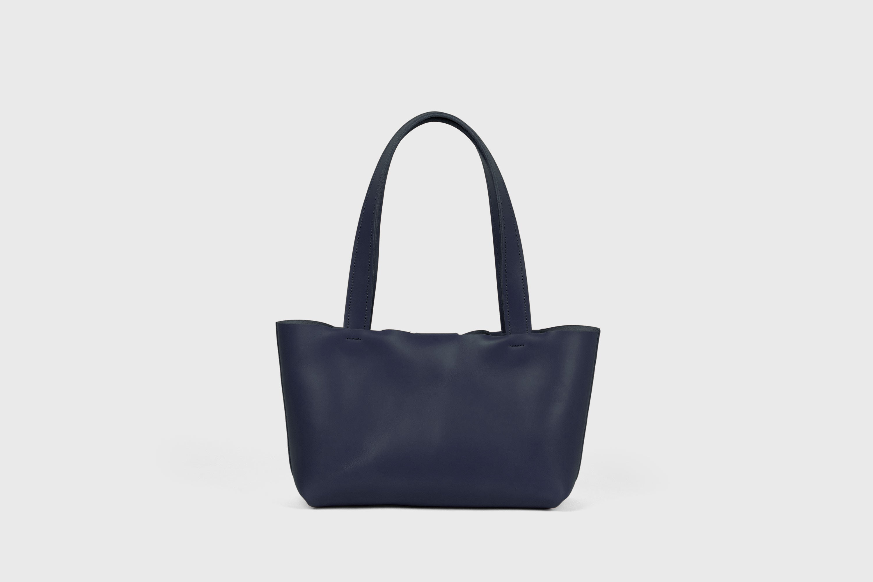 Karin Bag Closure In Marine Blue Color In Vegetable Tanned Leather Magnetic Closure Open Top Minimalistic Design Barcelona Spain