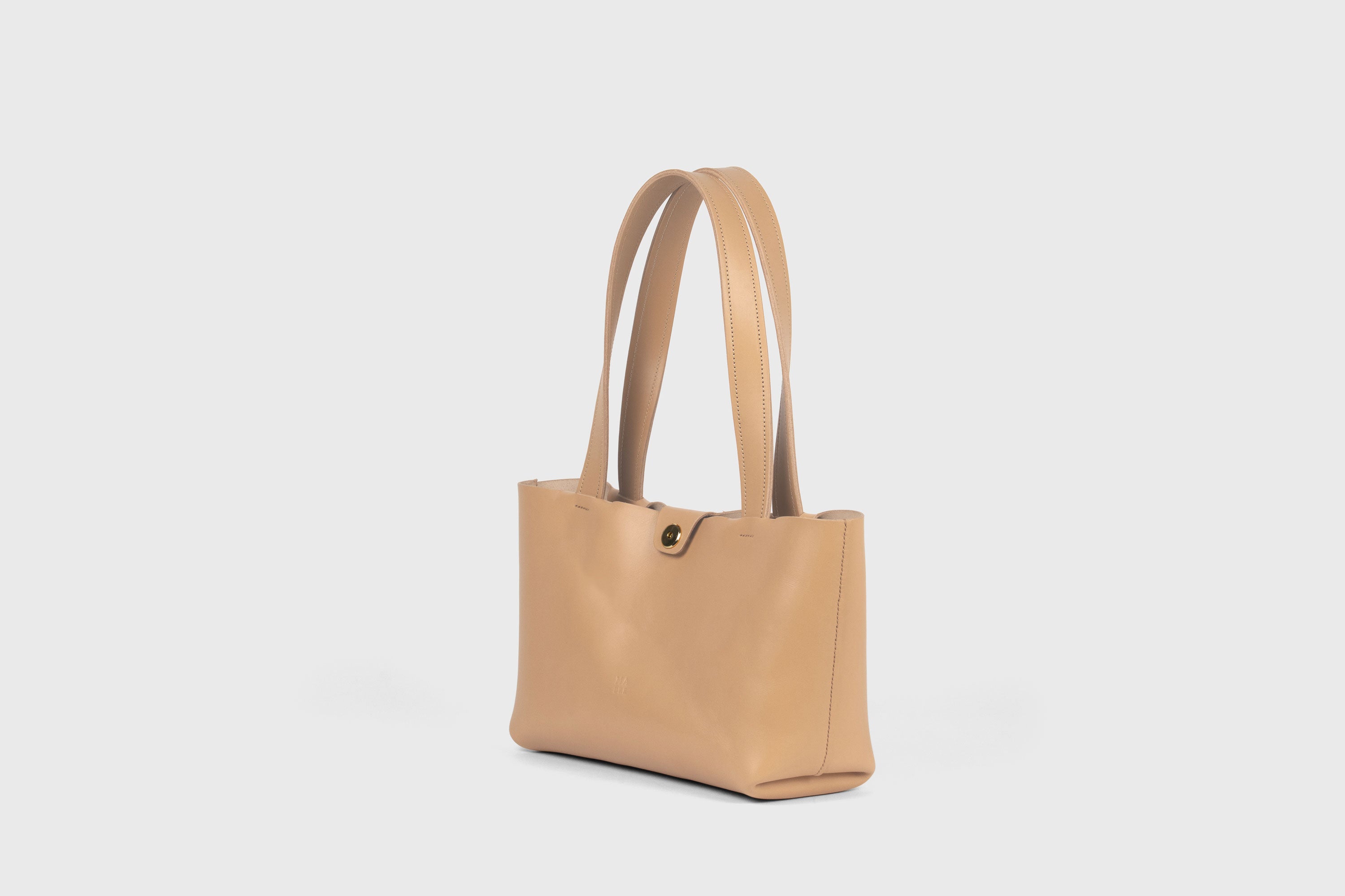 Karin Bag Closure In Natural Color In Vegetable Tanned Leather Magnetic Closure Open Top Minimalistic Design Barcelona Spain
