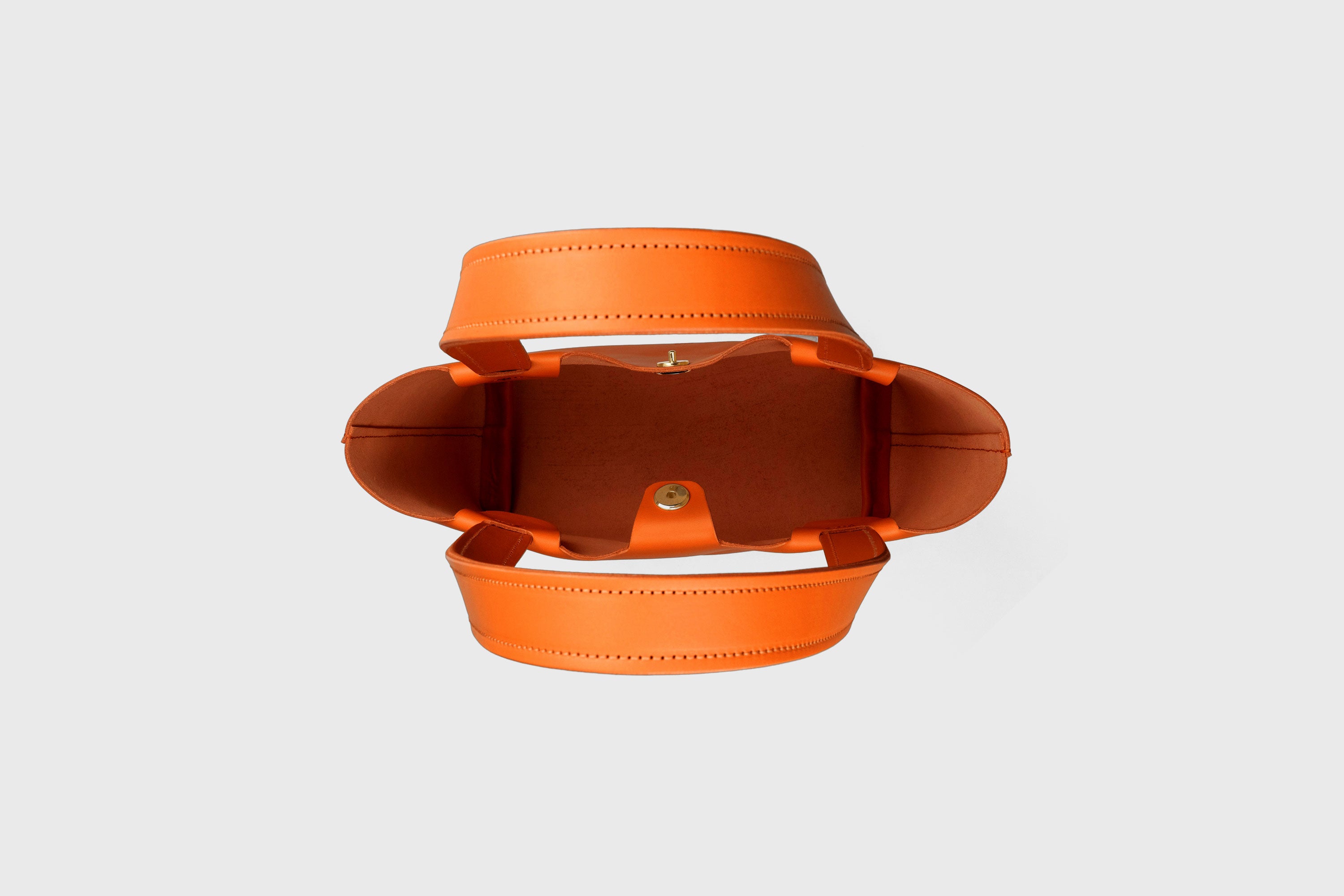 Karin Bag Closure In Orange Color In Vegetable Tanned Leather Magnetic Closure Open Top Minimalistic Design Barcelona Spain
