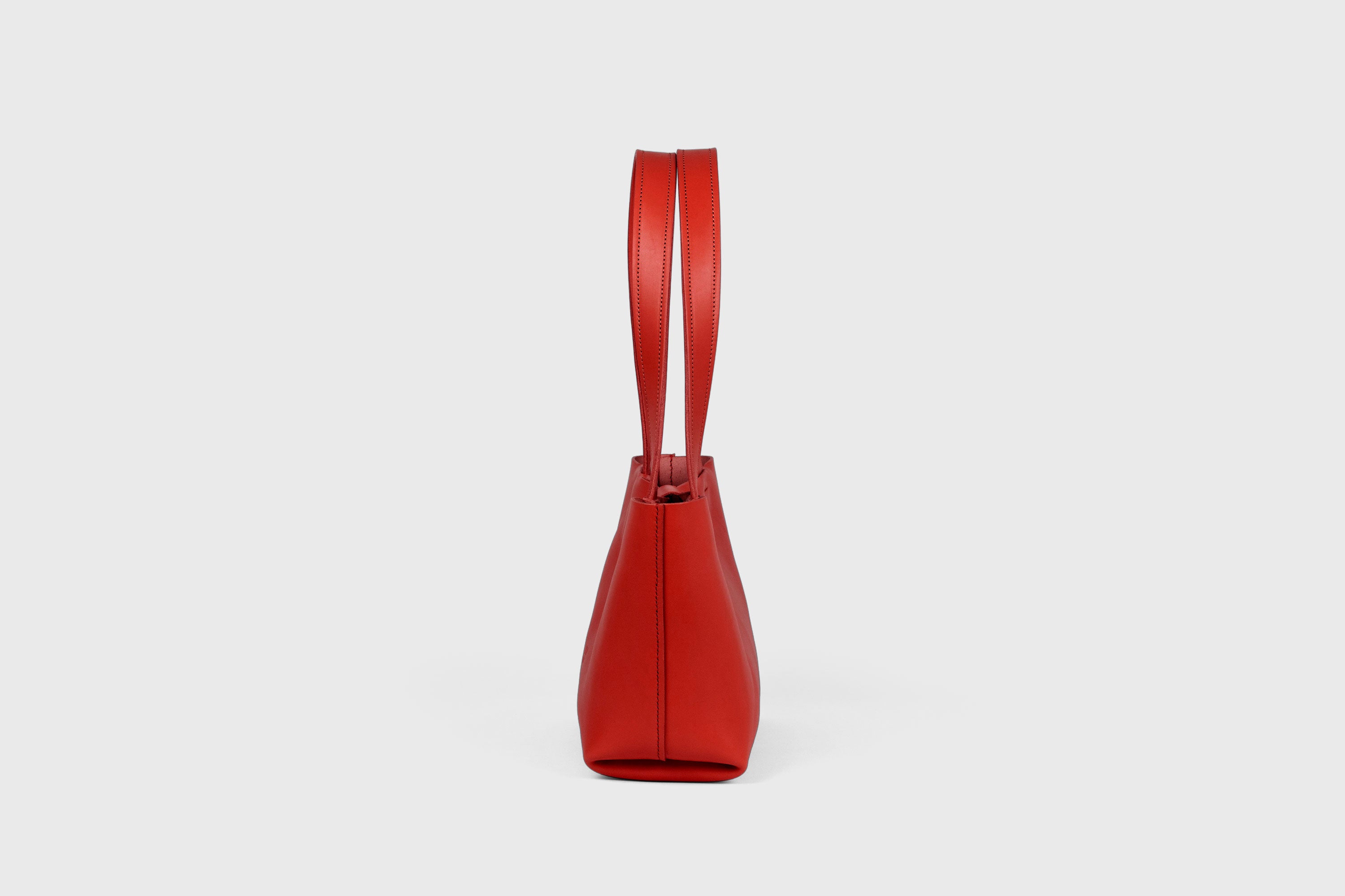 Karin Bag Closure In Red Color In Vegetable Tanned Leather Magnetic Closure Open Top Minimalistic Design Barcelona Spain