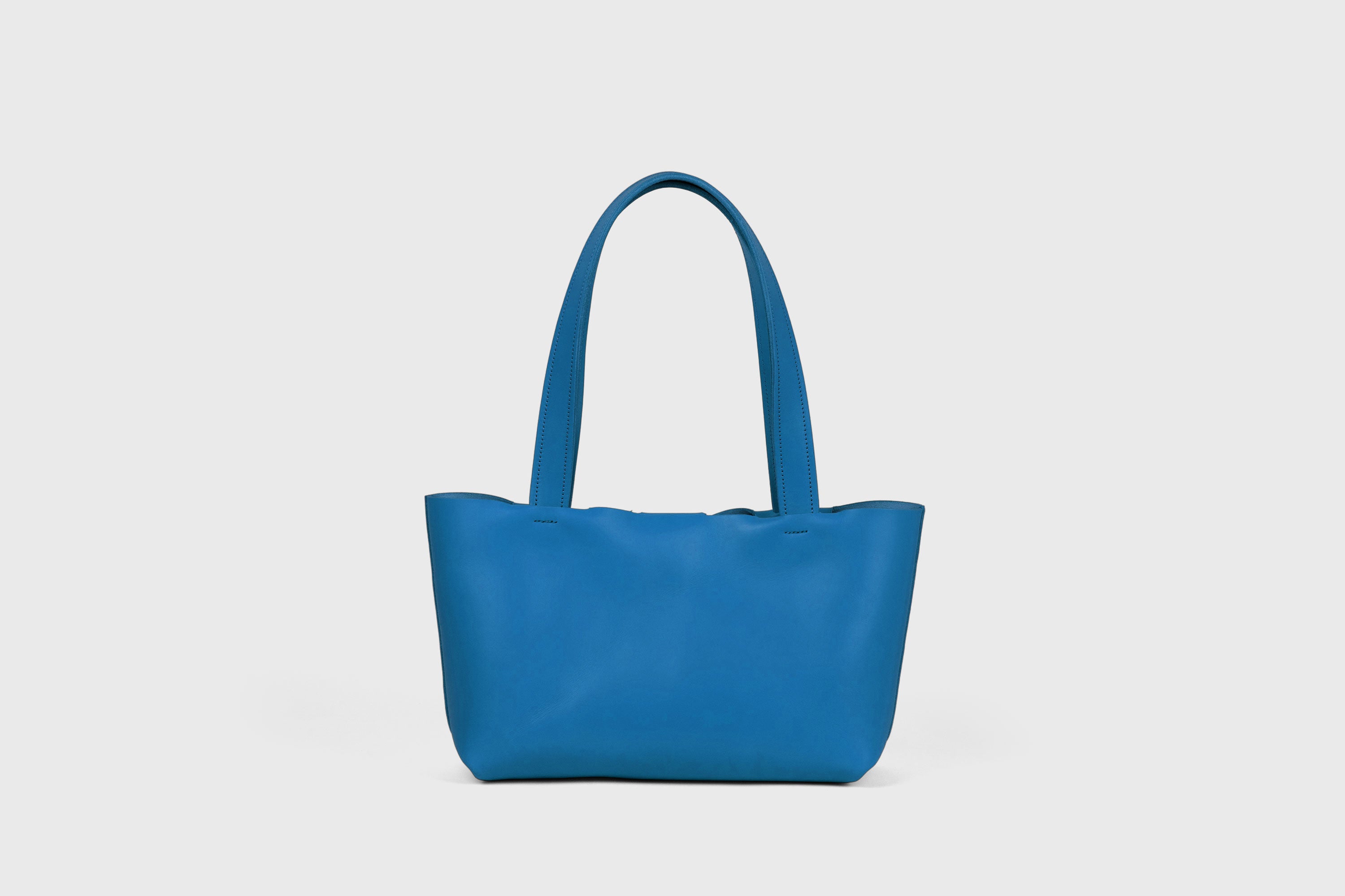 Karin Bag Closure In Royal Blue Color In Vegetable Tanned Leather Magnetic Closure Open Top Minimalistic Design Barcelona Spain
