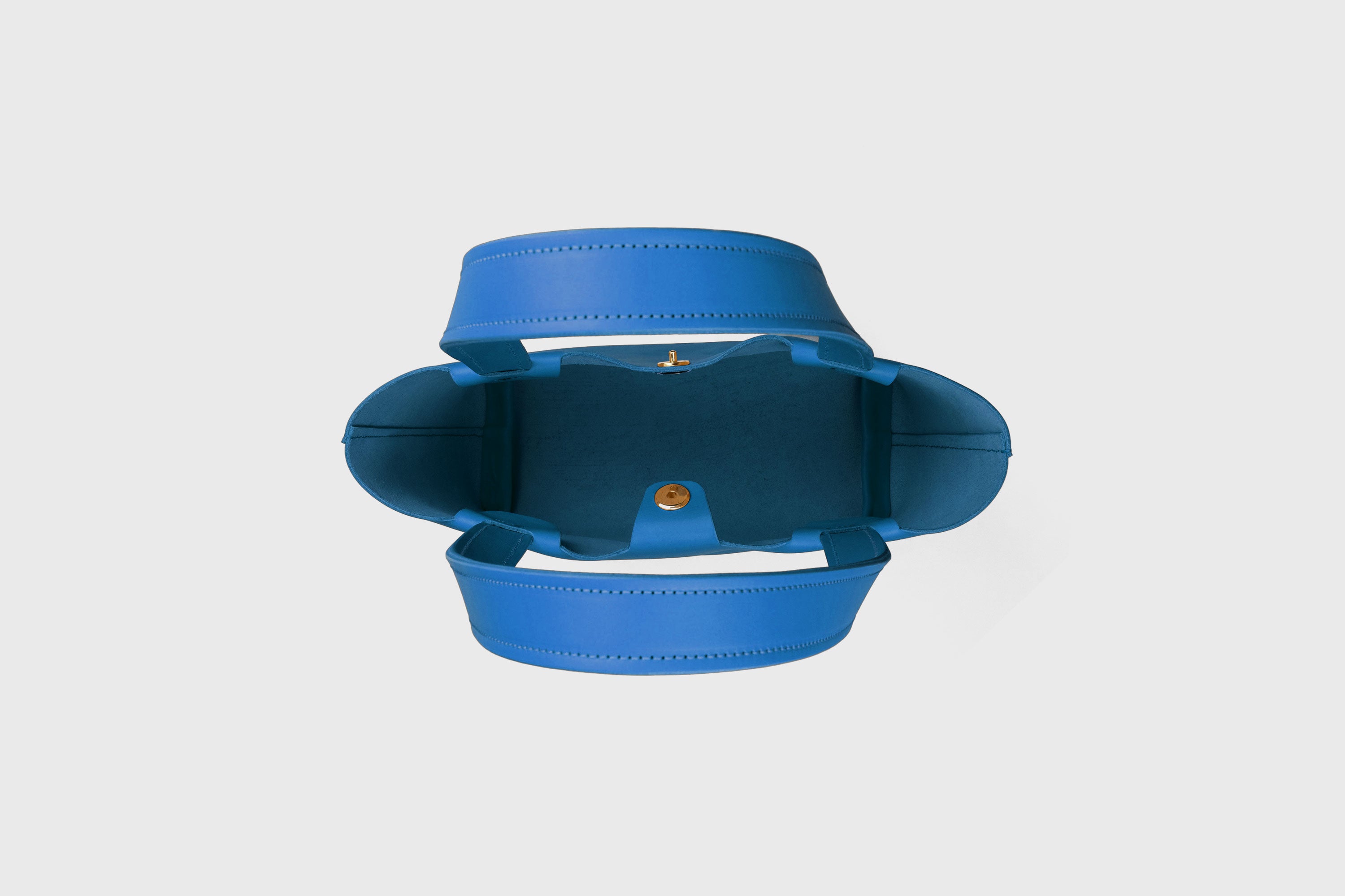 Karin Bag Closure In Royal Blue Color In Vegetable Tanned Leather Magnetic Closure Open Top Minimalistic Design Barcelona Spain