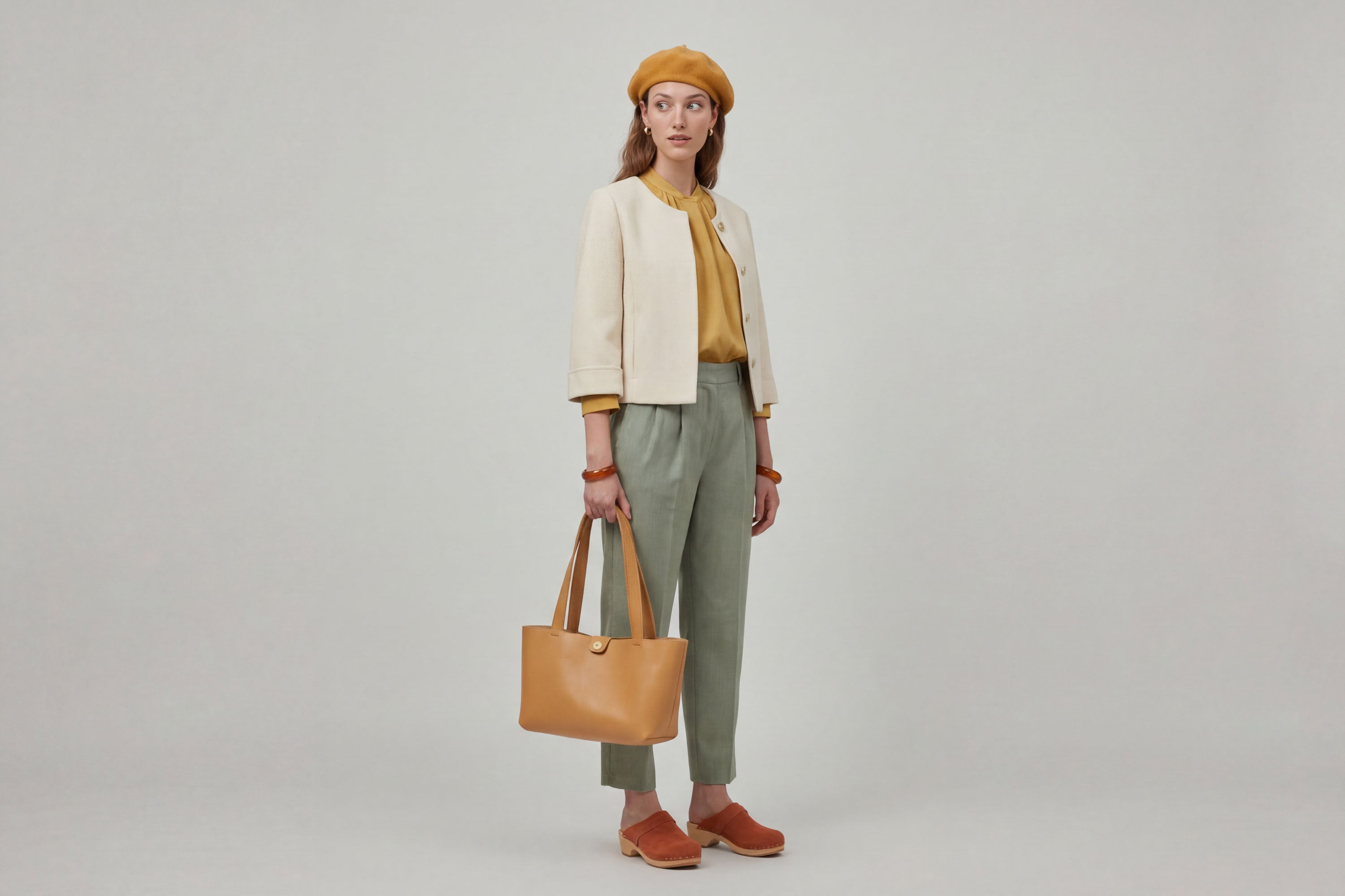 Karin Tote Bag Small Brown Color On A Woman Model Premium Leather Royal Blue Color Magnetic Closure Minimalist Design Atelier Madre Manuel Dreesmann Barcelona Spain