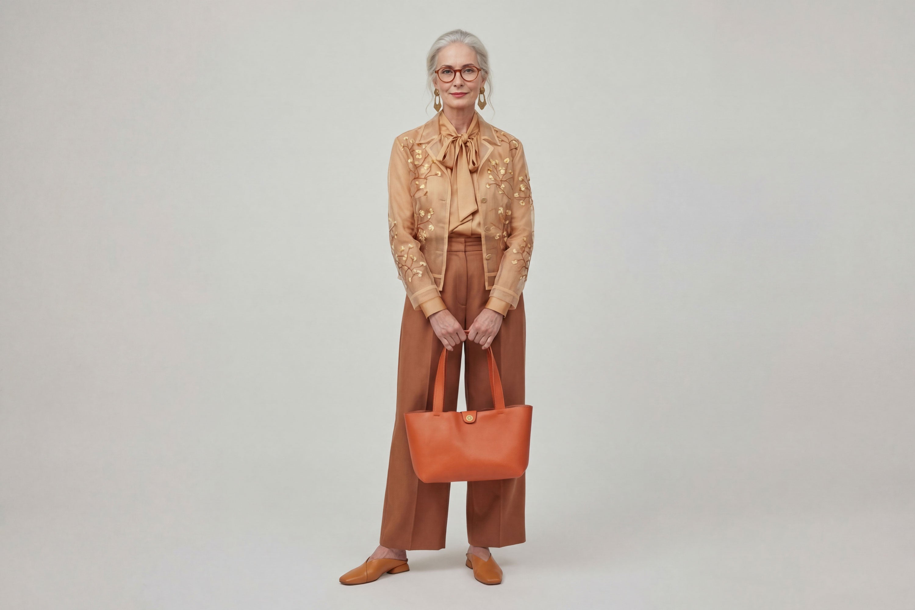 Karin Tote Bag Small Orange Color On A Woman Model Premium Leather Royal Blue Color Magnetic Closure Minimalist Design Atelier Madre Manuel Dreesmann Barcelona Spain