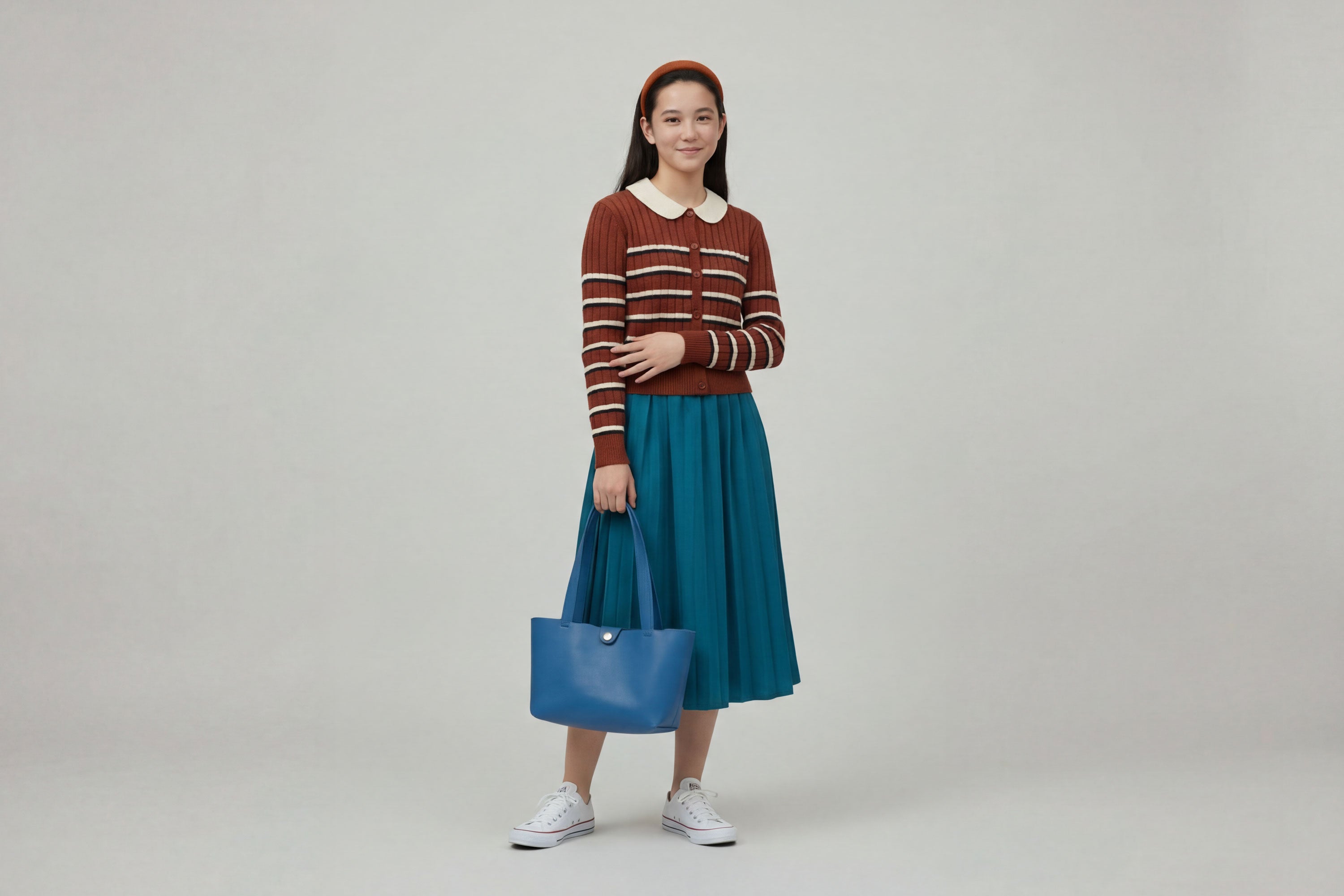 Karin Tote Bag Small Royal Blue Color On A Woman Model Premium Leather Royal Blue Color Magnetic Closure Minimalist Design Atelier Madre Manuel Dreesmann Barcelona Spain