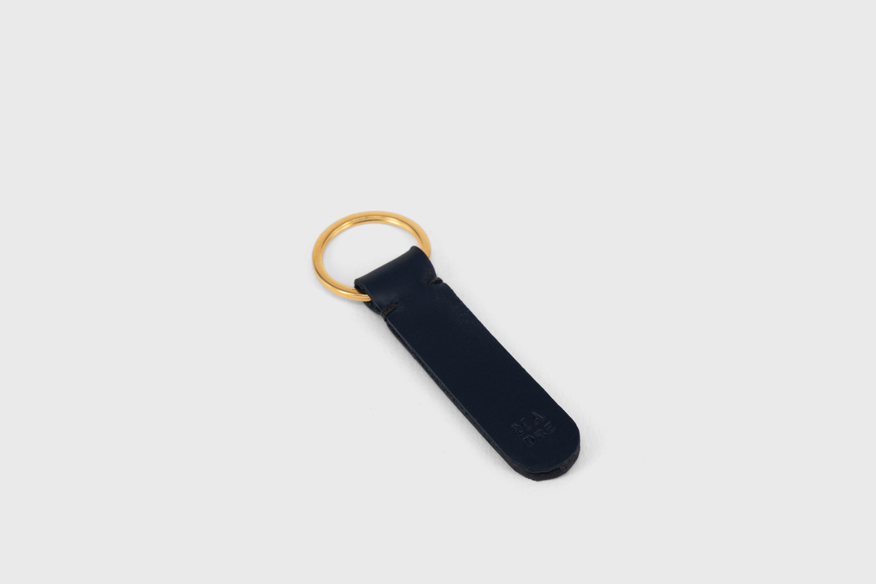 Key Ring Leather Dark Marine Blue Color Fob Minimalist Designer Vegetable Tanned Full Grain Handcrafted Personalised Premium Quality Gold Atelier Madre Manuel Dreesmann Barcelona Spain