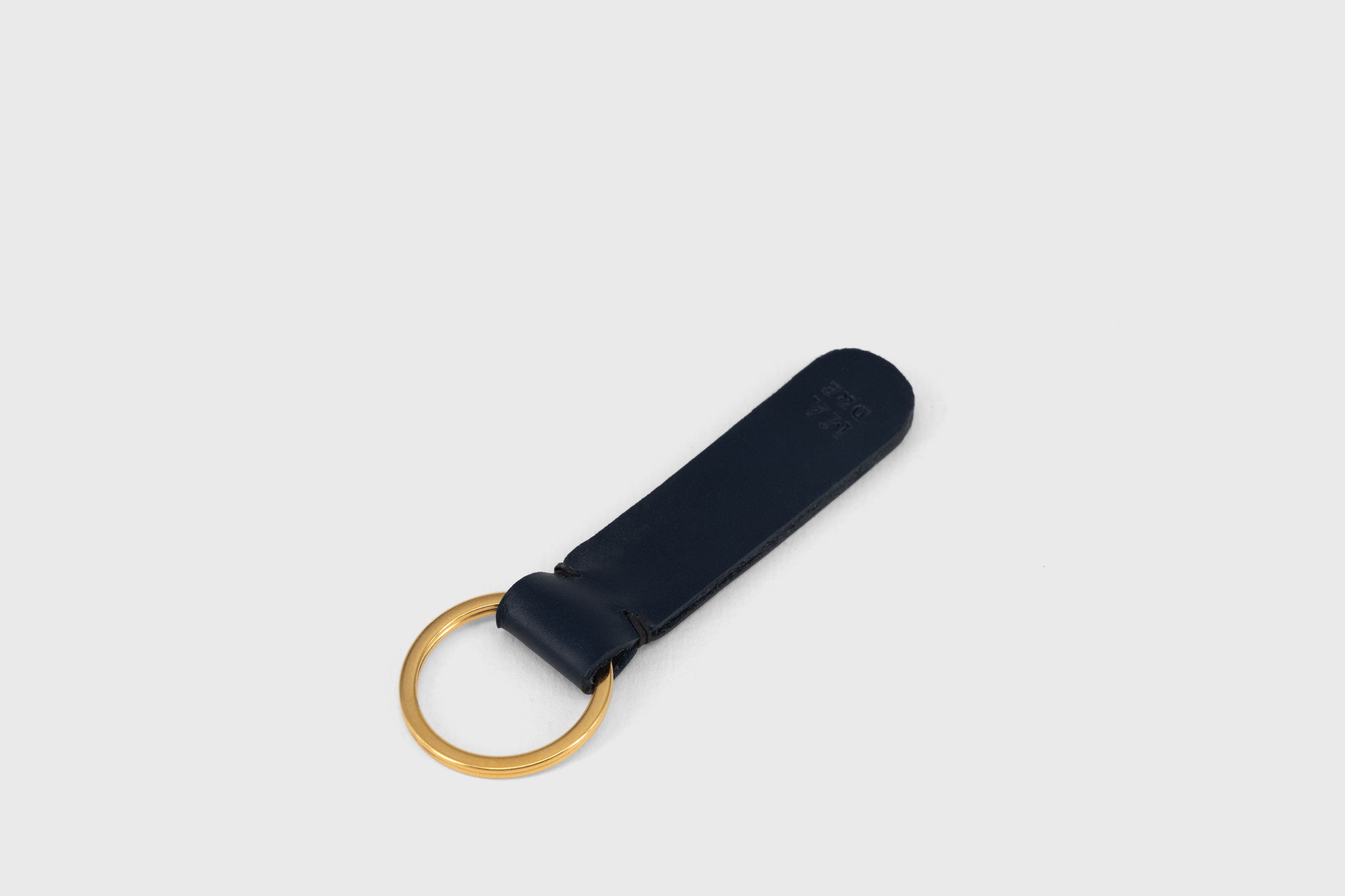 Key Ring Leather Dark Marine Blue Color Fob Minimalist Designer Vegetable Tanned Full Grain Handcrafted Personalised Premium Quality Gold Atelier Madre Manuel Dreesmann Barcelona Spain