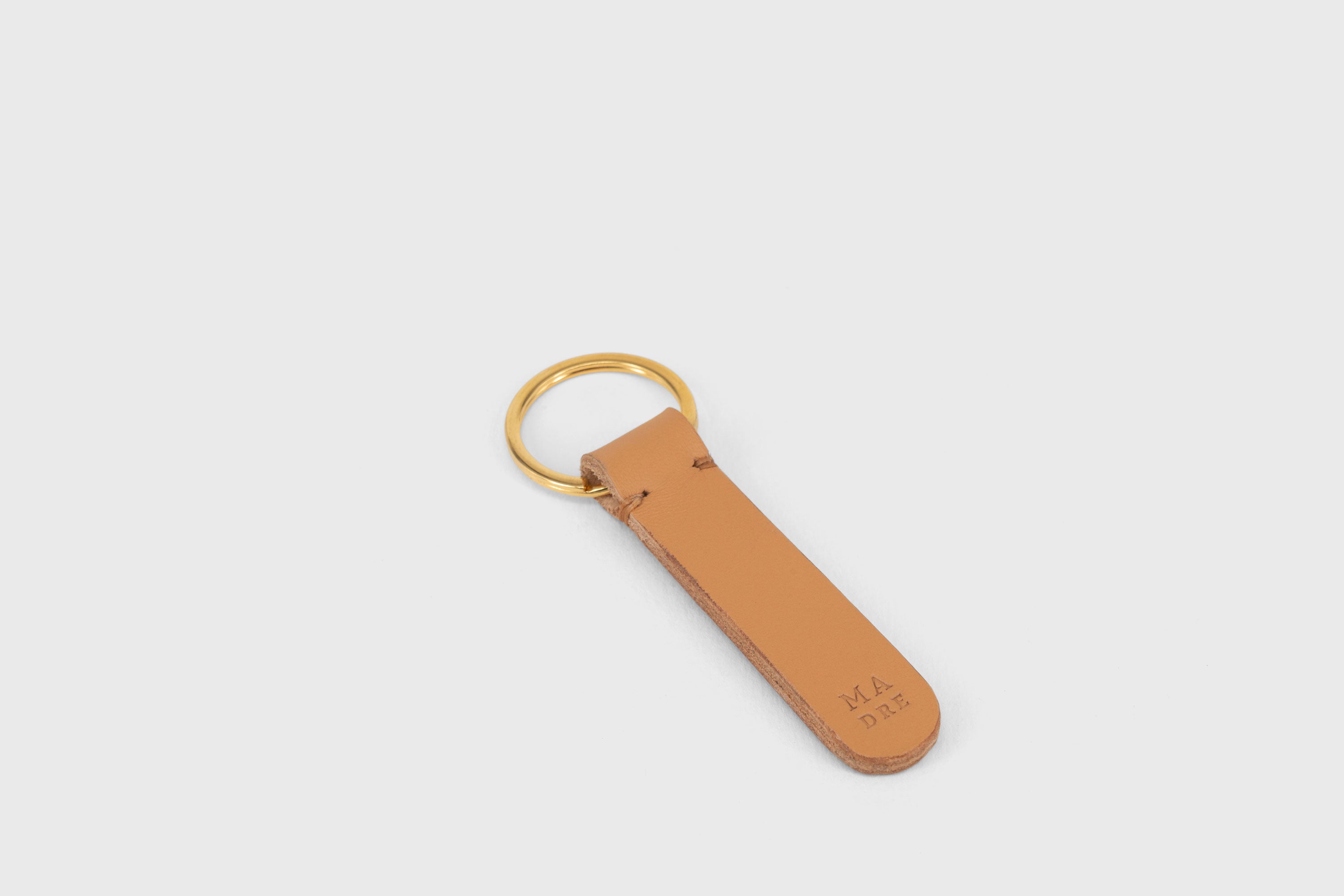 Key Ring Leather Brown Color Fob Minimalist Designer Vegetable Tanned Full Grain Handcrafted Personalised Premium Quality Gold Atelier Madre Manuel Dreesmann Barcelona Spain