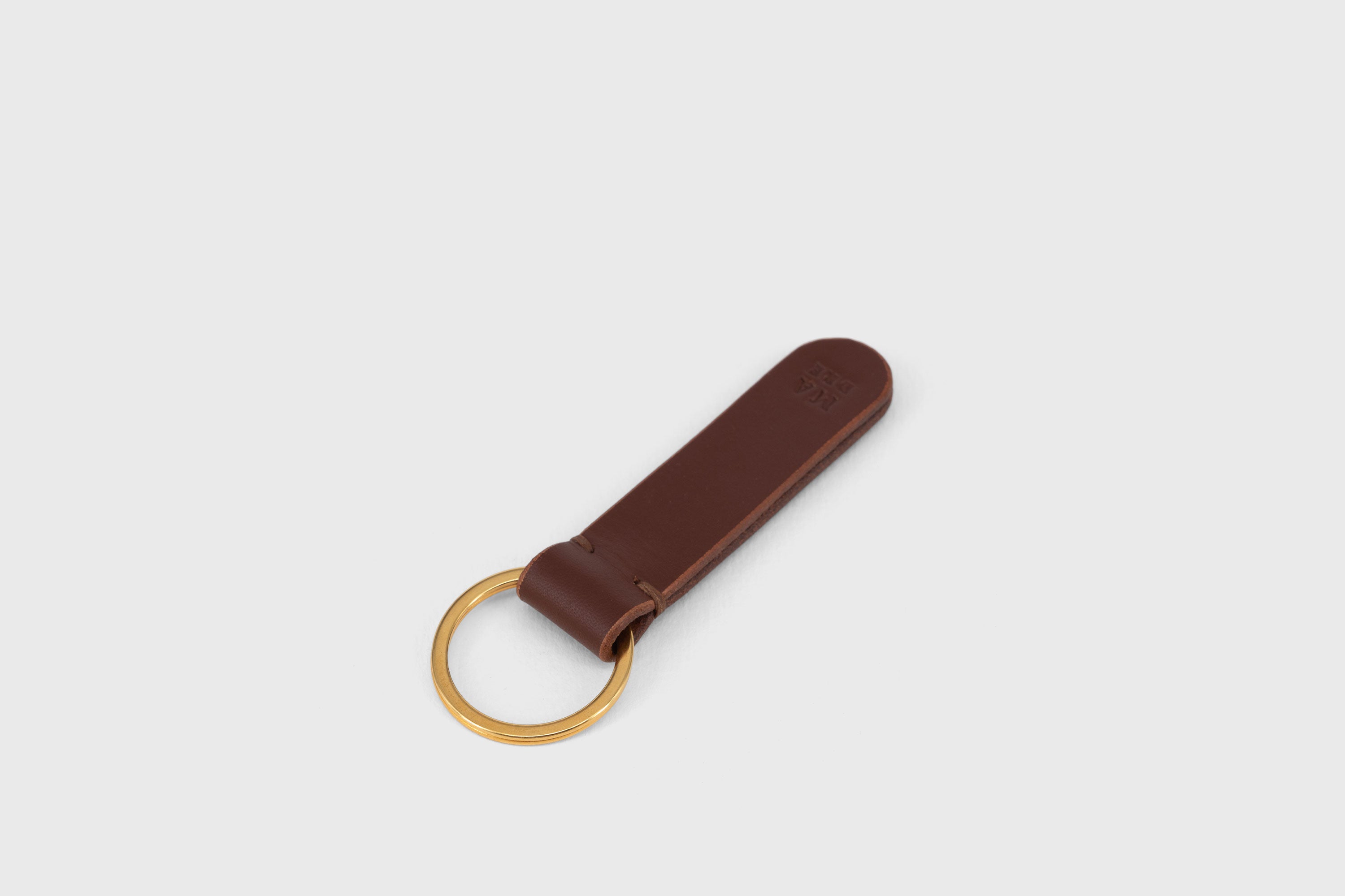 Key Ring Leather Dark Brown Color Fob Minimalist Designer Vegetable Tanned Full Grain Handcrafted Personalised Premium Quality Gold Atelier Madre Manuel Dreesmann Barcelona Spain