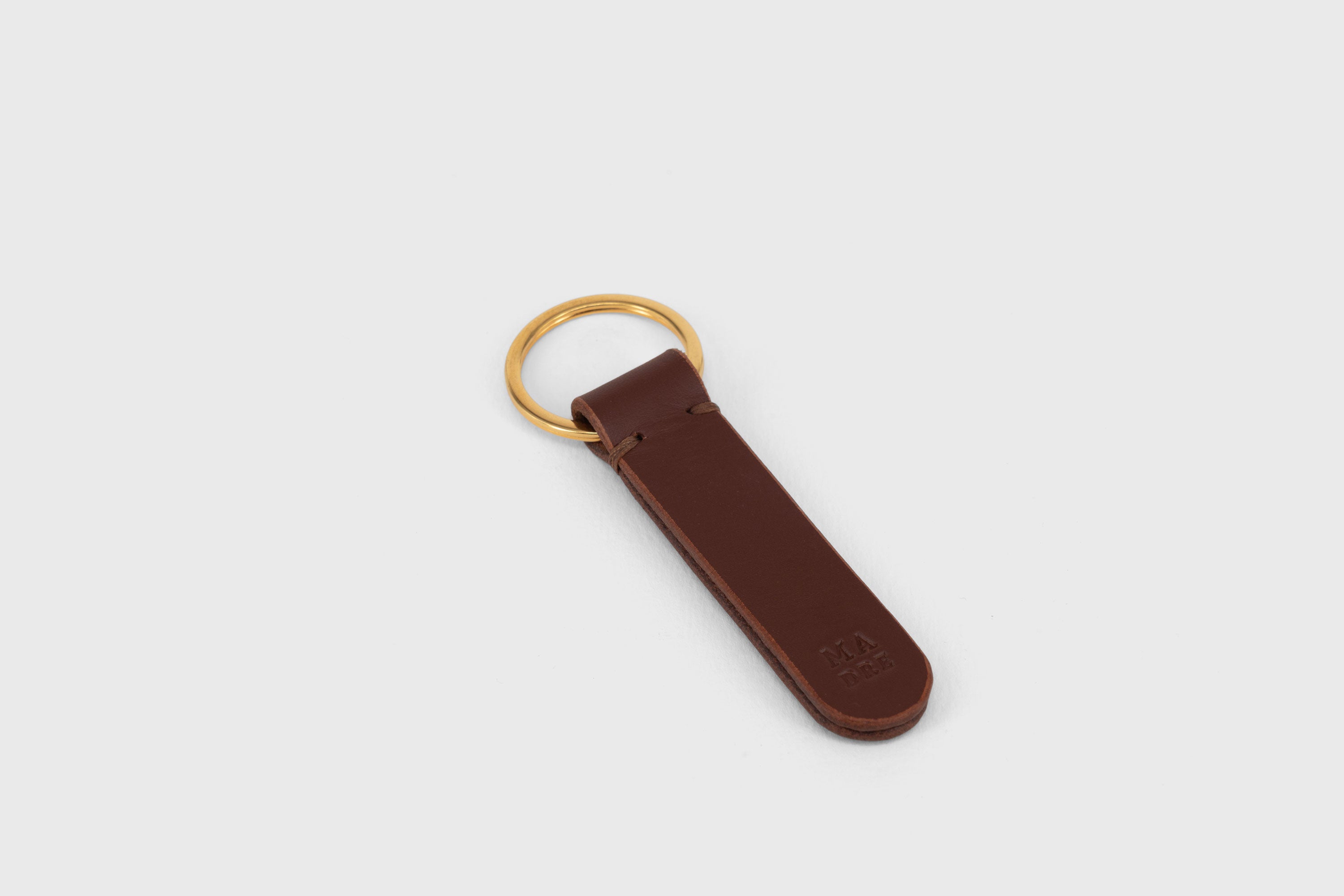 Key Ring Leather Dark Brown Color Fob Minimalist Designer Vegetable Tanned Full Grain Handcrafted Personalised Premium Quality Gold Atelier Madre Manuel Dreesmann Barcelona Spain