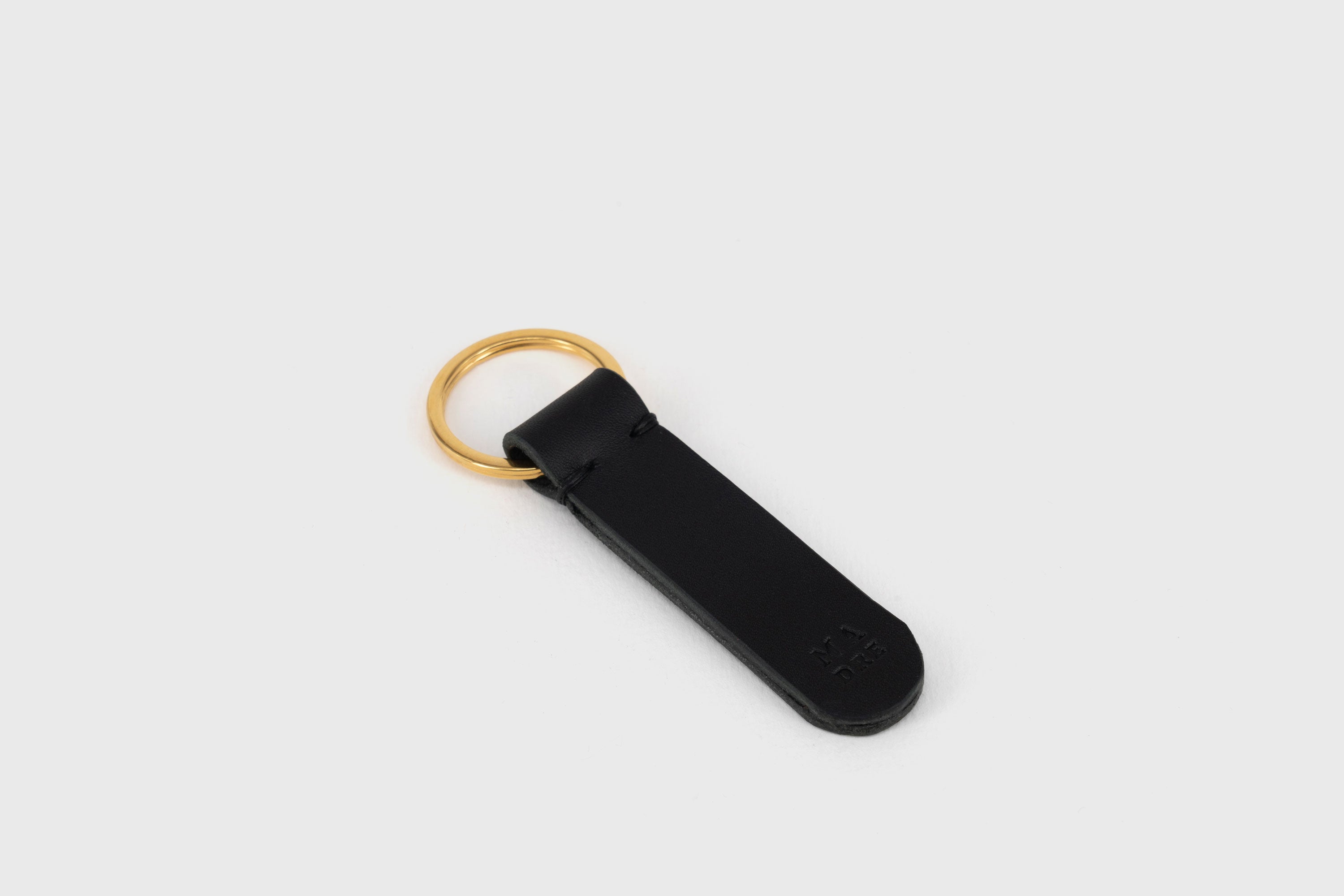 Key Ring Leather Black Color Fob Minimalist Designer Vegetable Tanned Full Grain Handcrafted Personalised Premium Quality Gold Atelier Madre Manuel Dreesmann Barcelona Spain