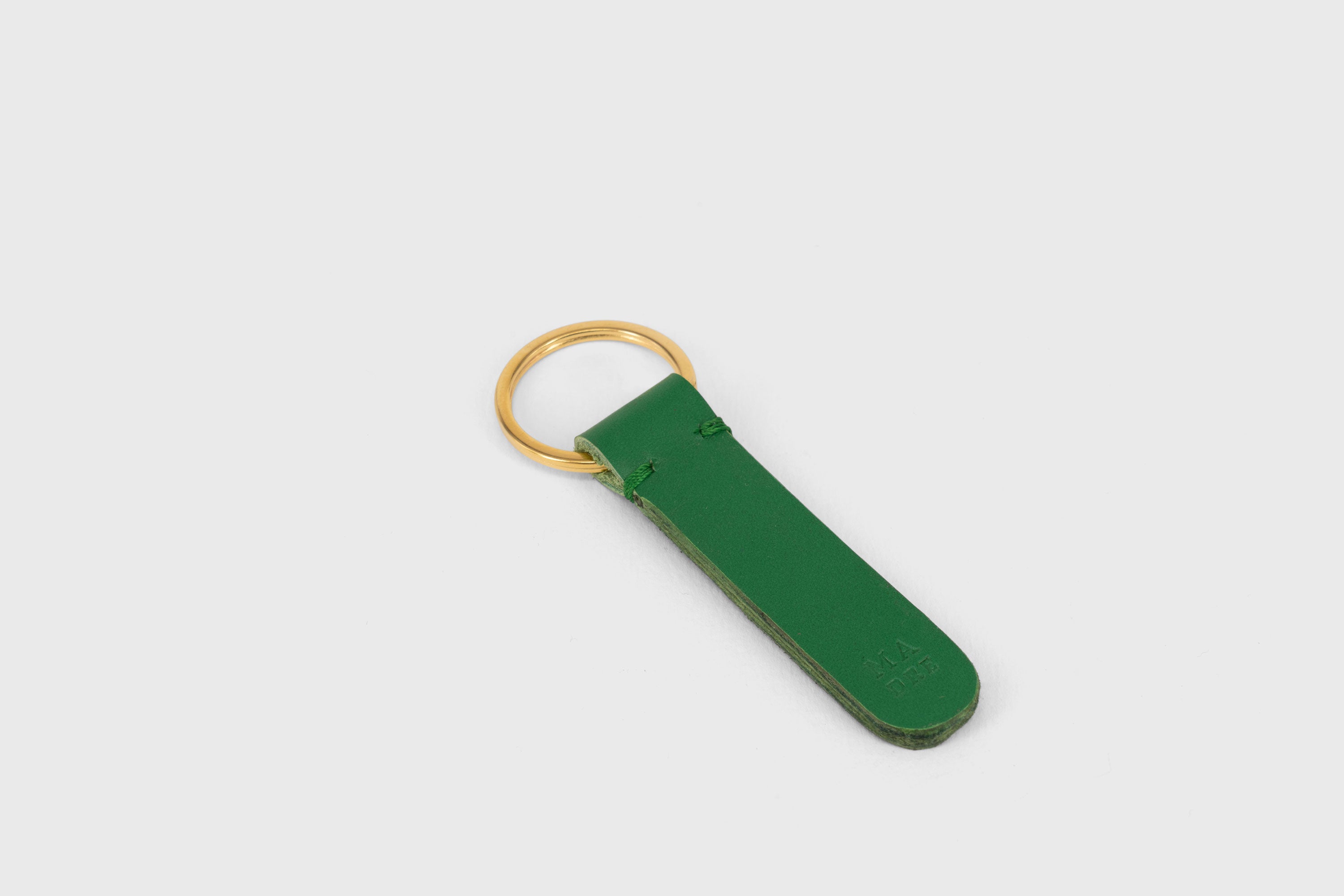 Key Ring Leather Grass Green Color Fob Minimalist Designer Vegetable Tanned Full Grain Handcrafted Personalised Premium Quality Gold Atelier Madre Manuel Dreesmann Barcelona Spain